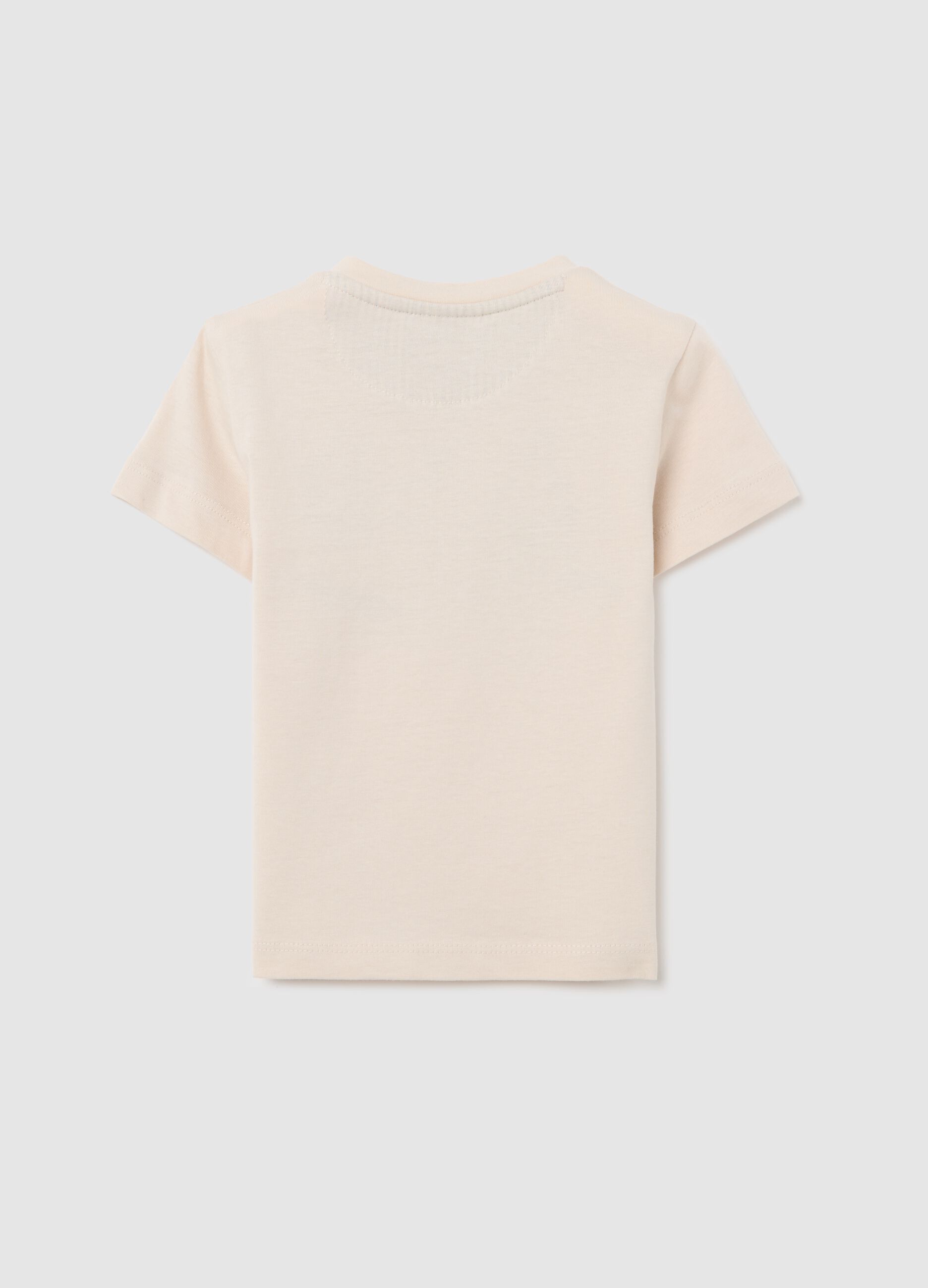 Beige top with short sleeves and boats