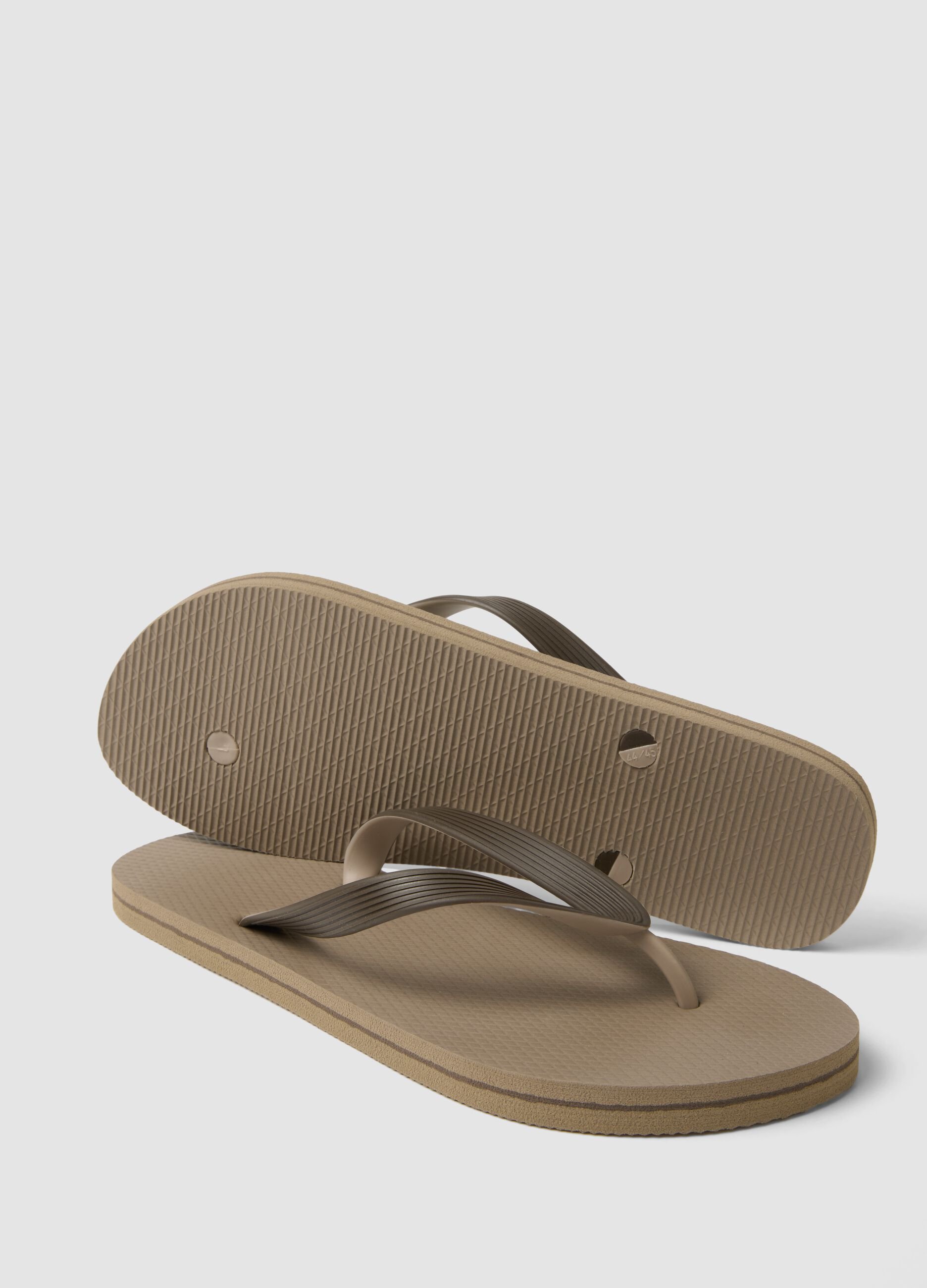 Beige beach flip-flops