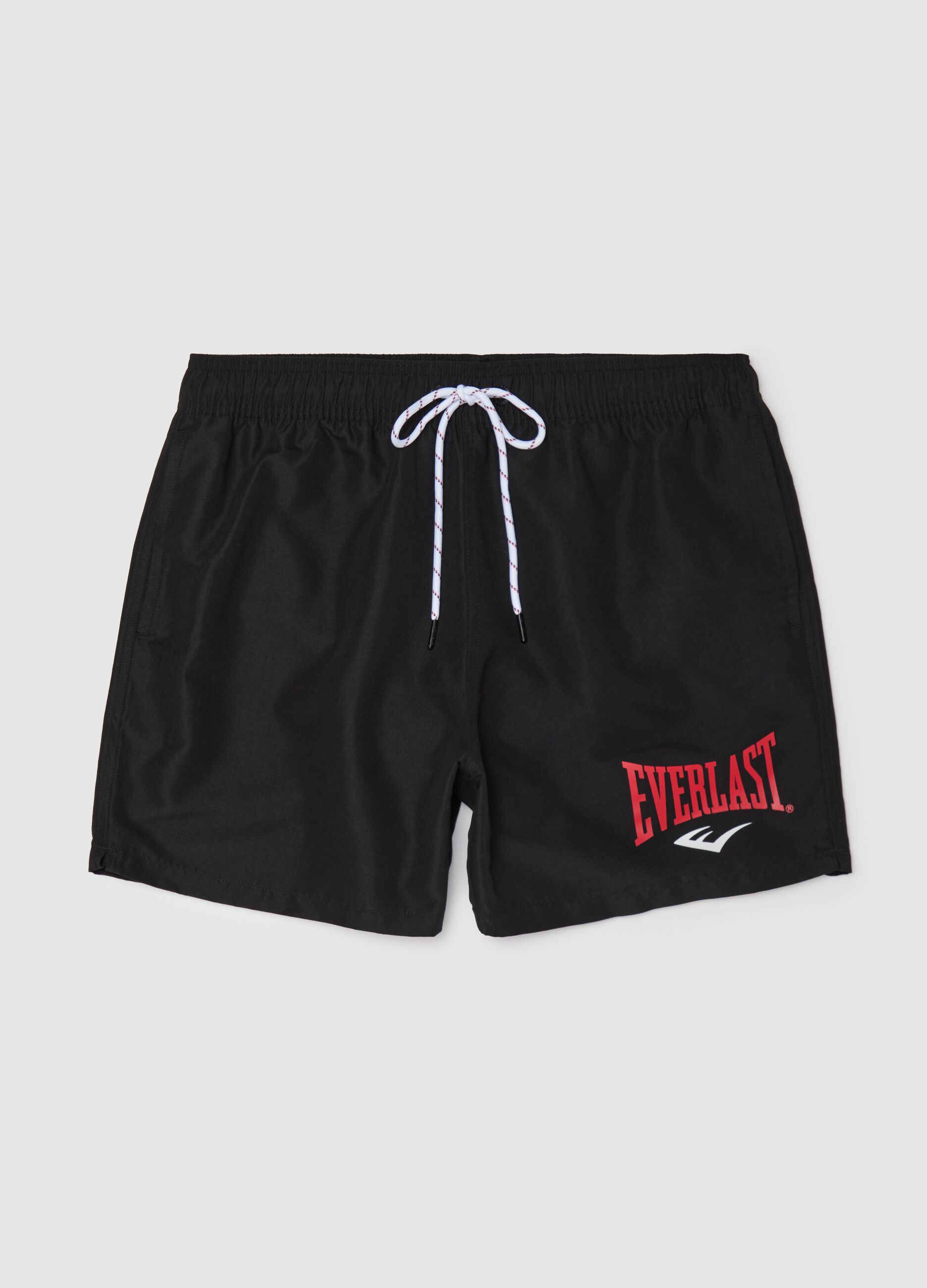 Black swimming trunks with logo print