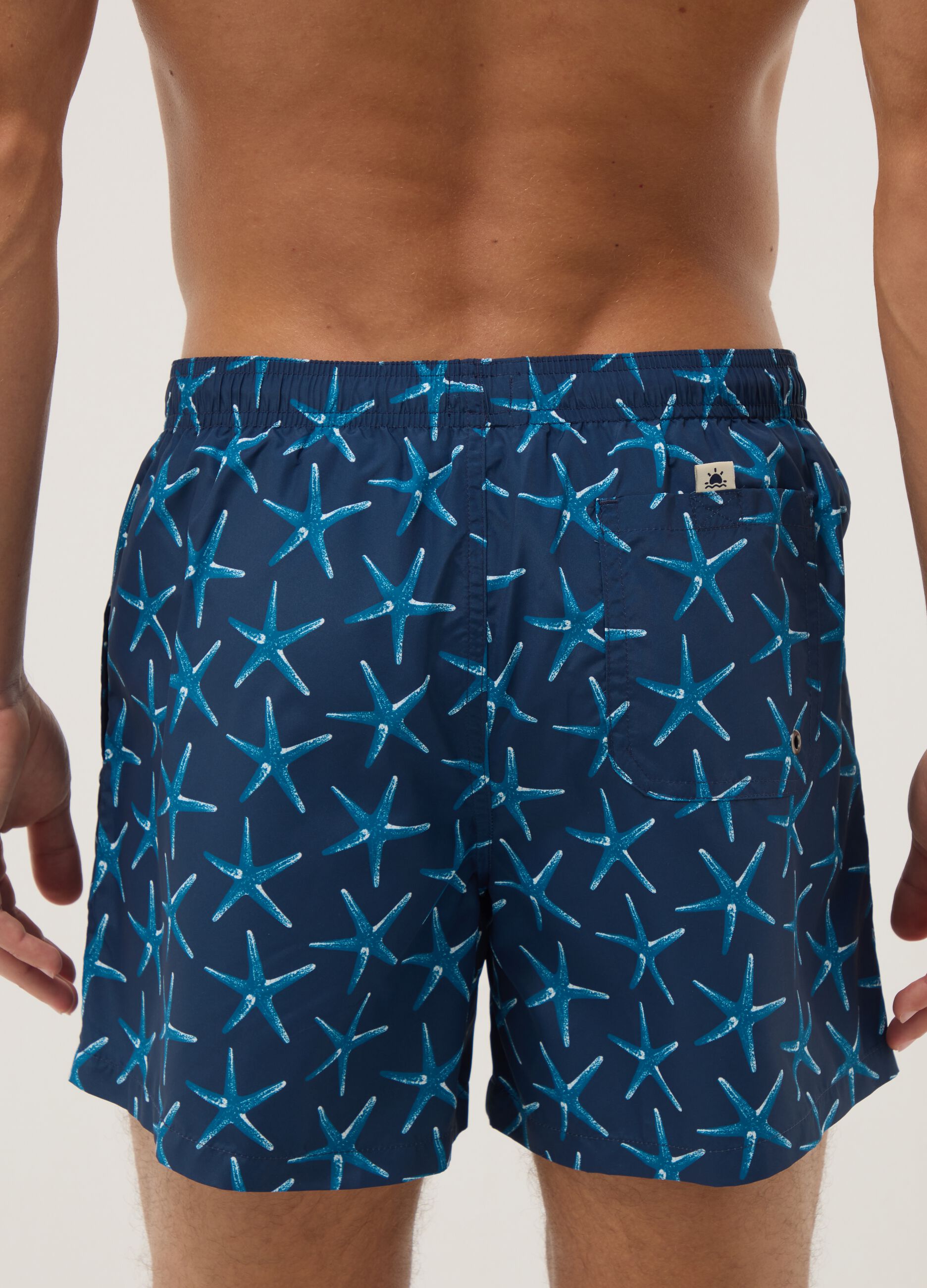 Blue boxer swim shorts with starfish print