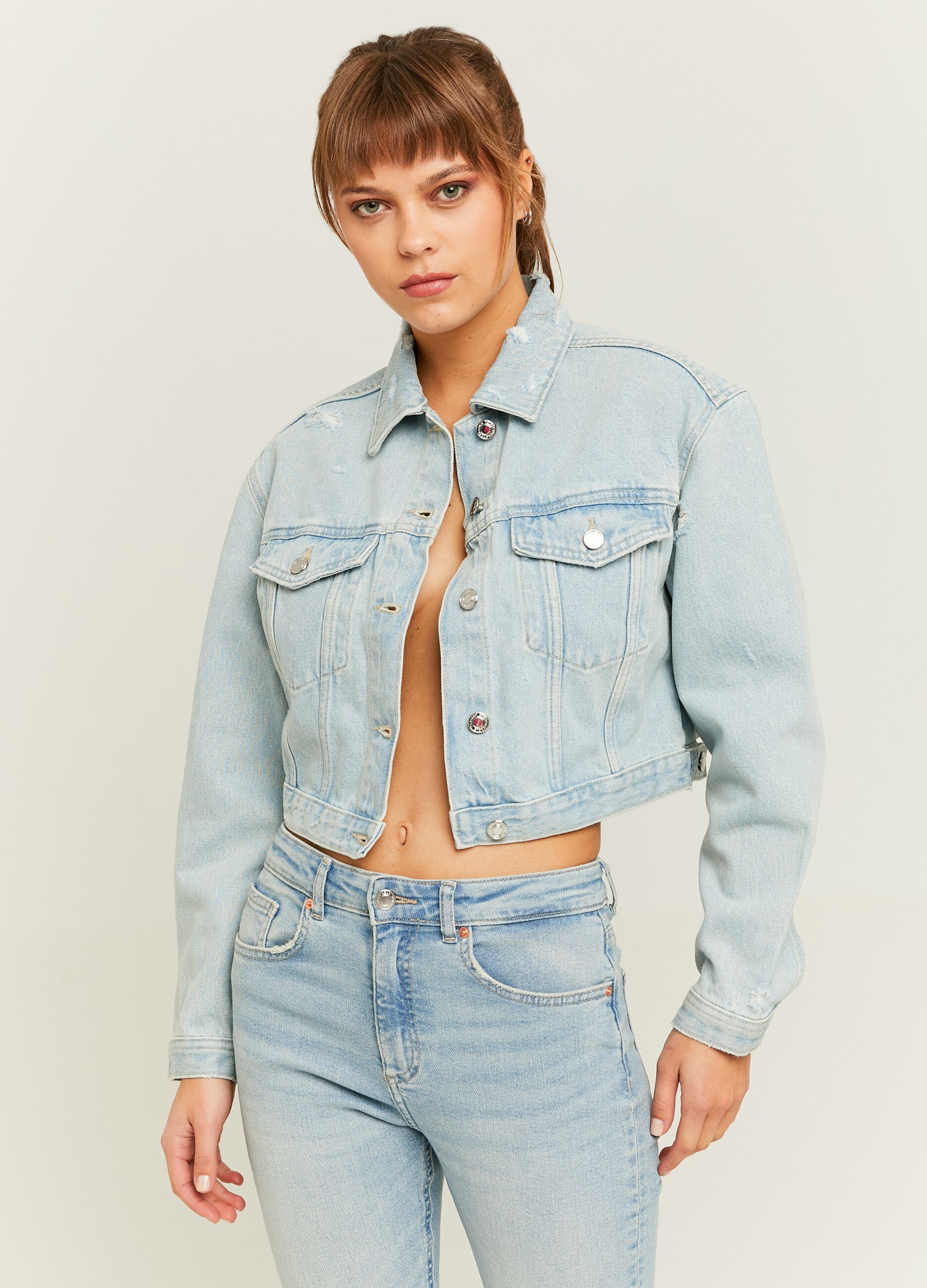 Giacca crop in denim acid wash