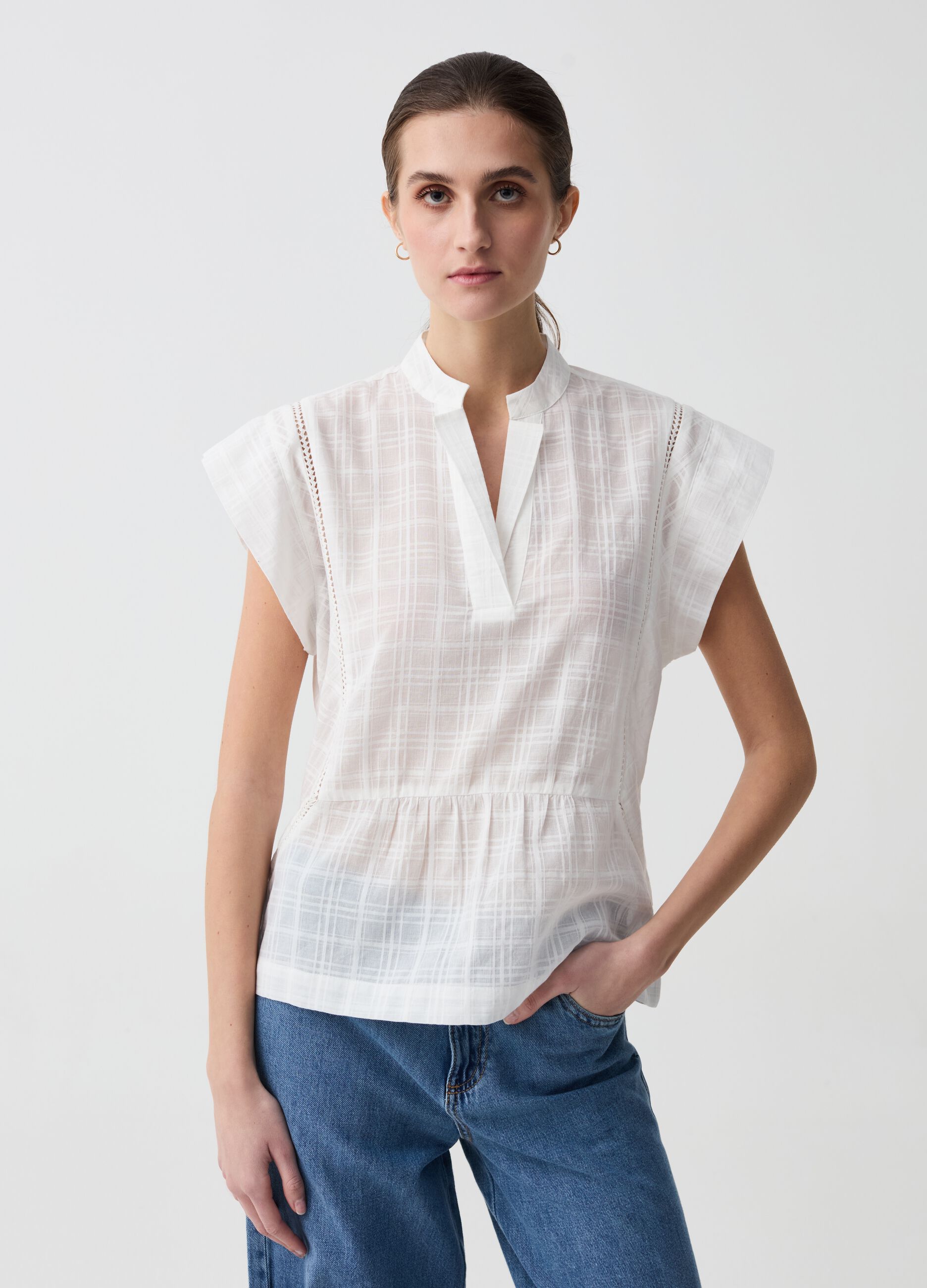 Blouse with check design and à jour embroidery