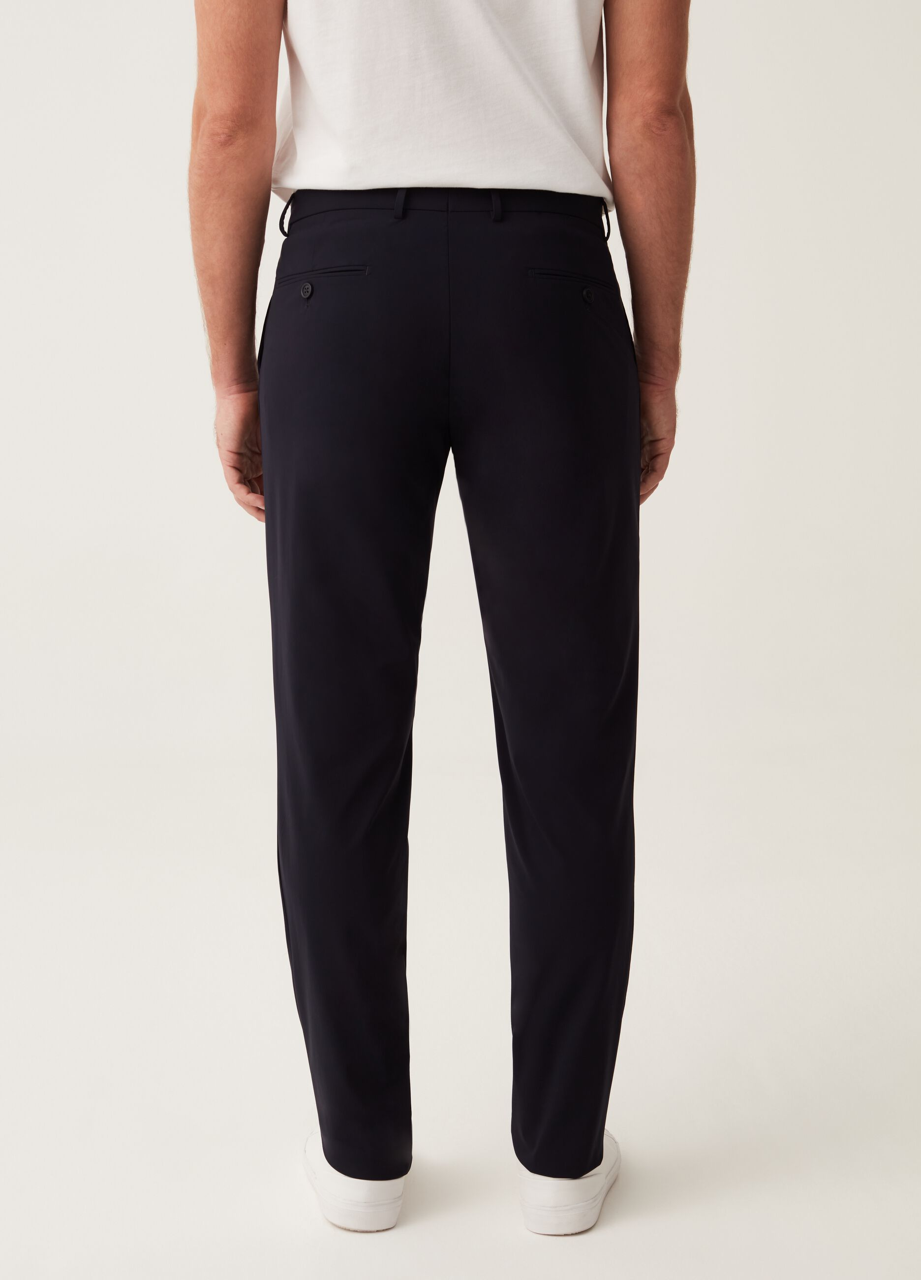 Slim-fit trousers in navy blue technical fabric
