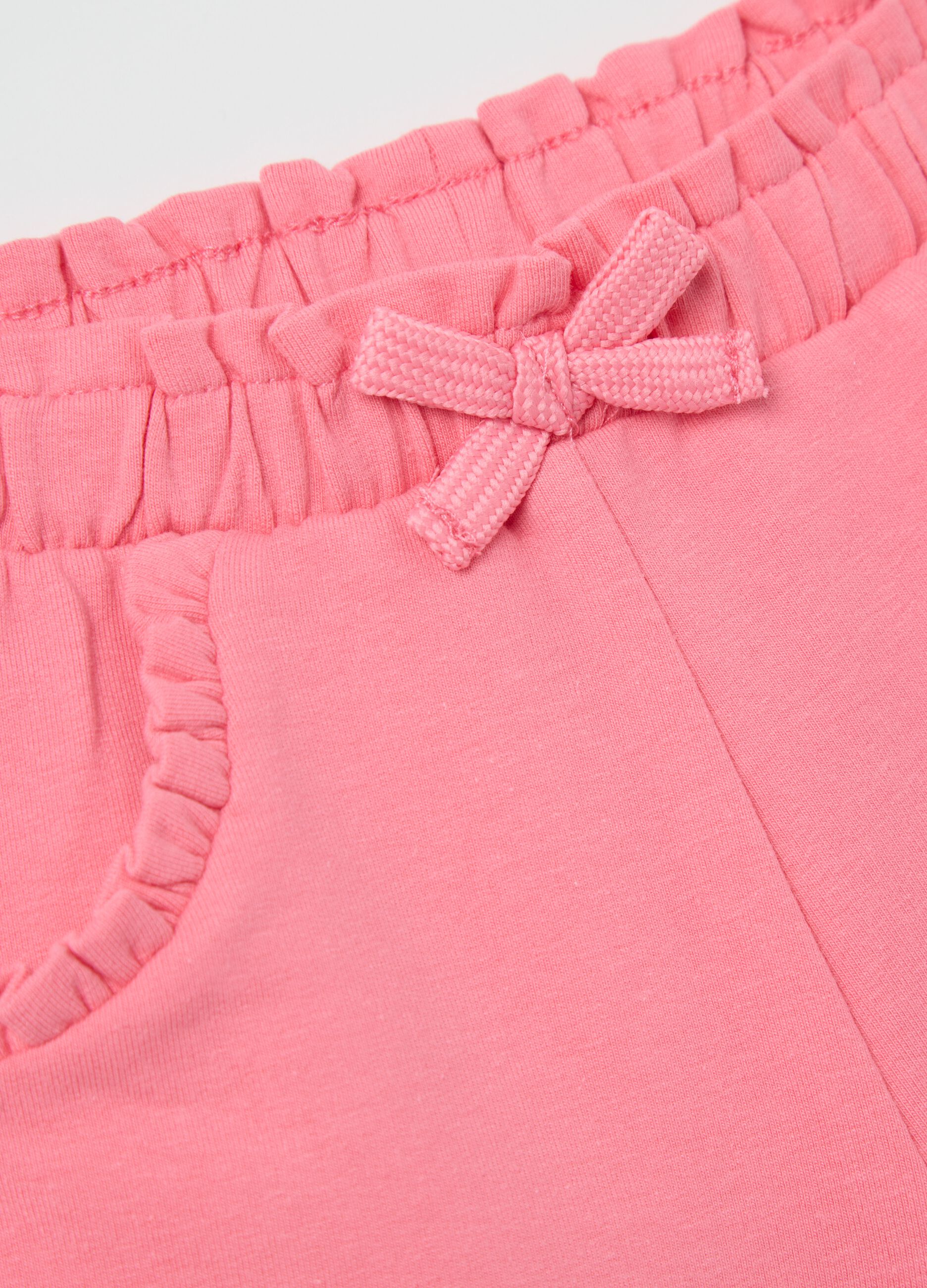 Pink French terry shorts with bow and frills