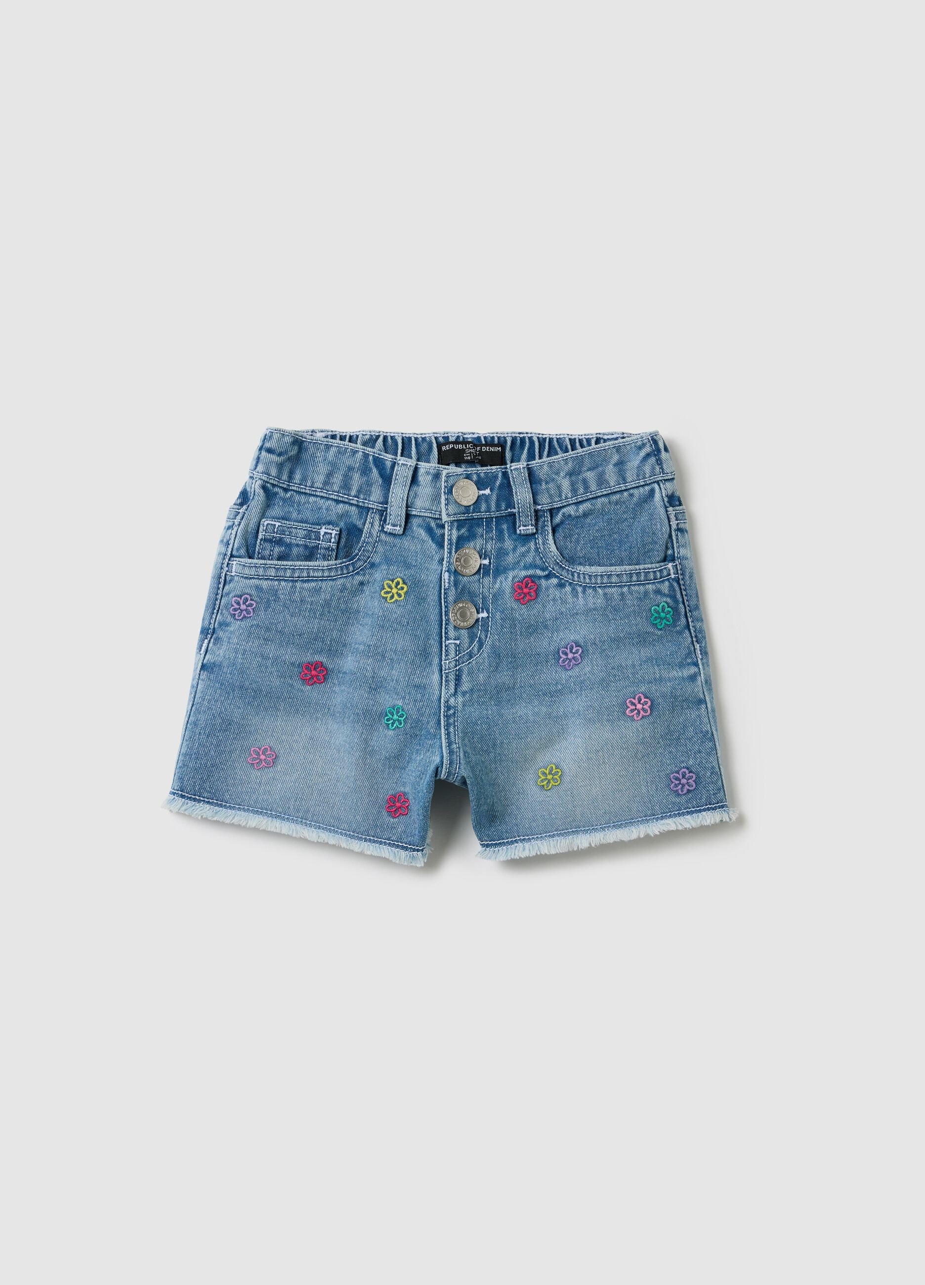 Light blue denim shorts with floral embroidery