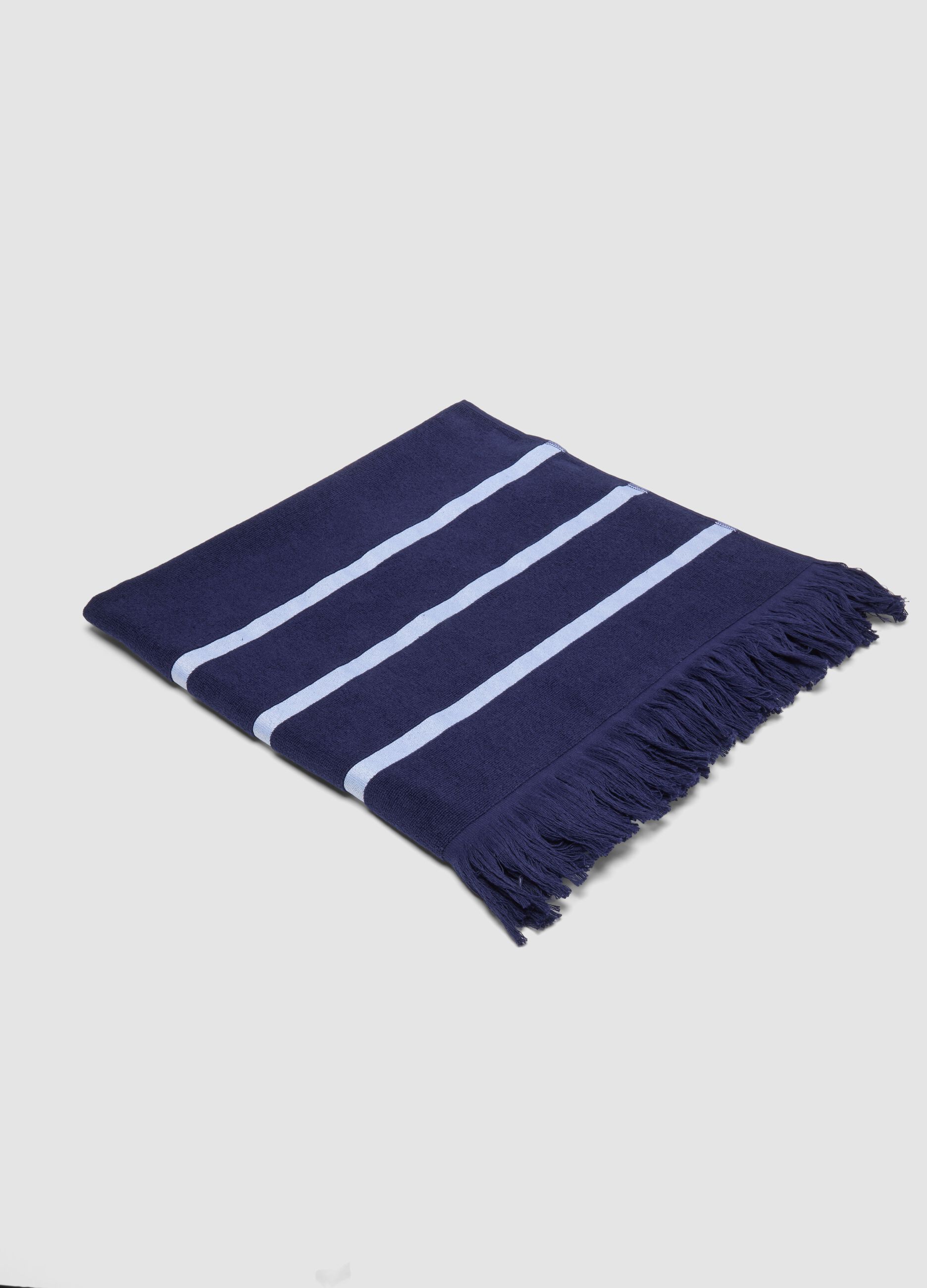 Telo mare blu in misto cotone con frange