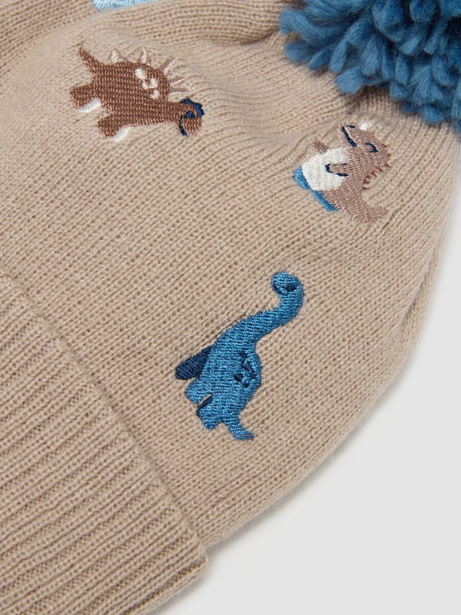 Cappello beige con pon pon e dinosauri_2