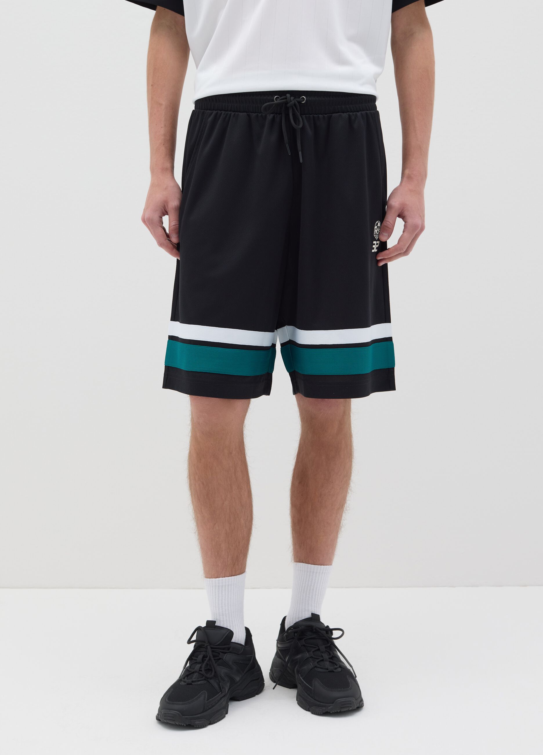 Black Bermuda joggers with NFC print