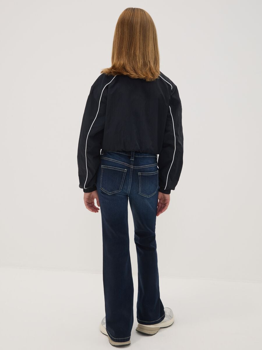 Jeans blu flare in cotone elasticizzato per ragazza_1