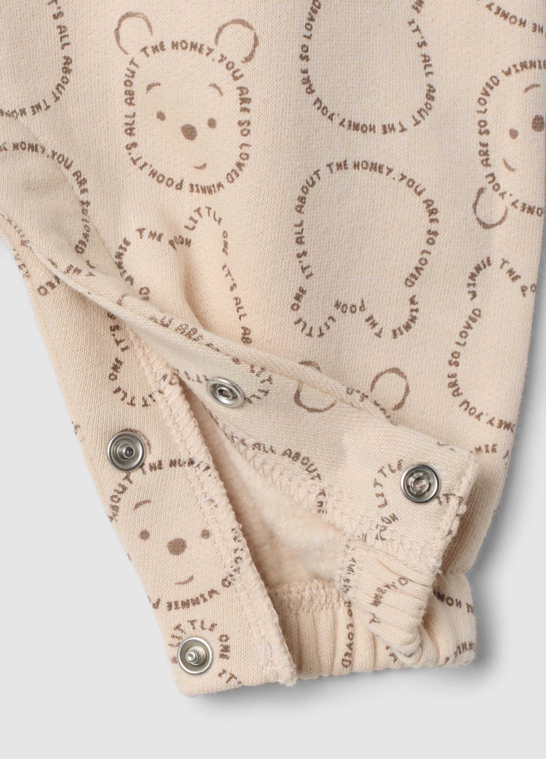 Grey organic cotton sleepsuit with Winnie the Pooh print
