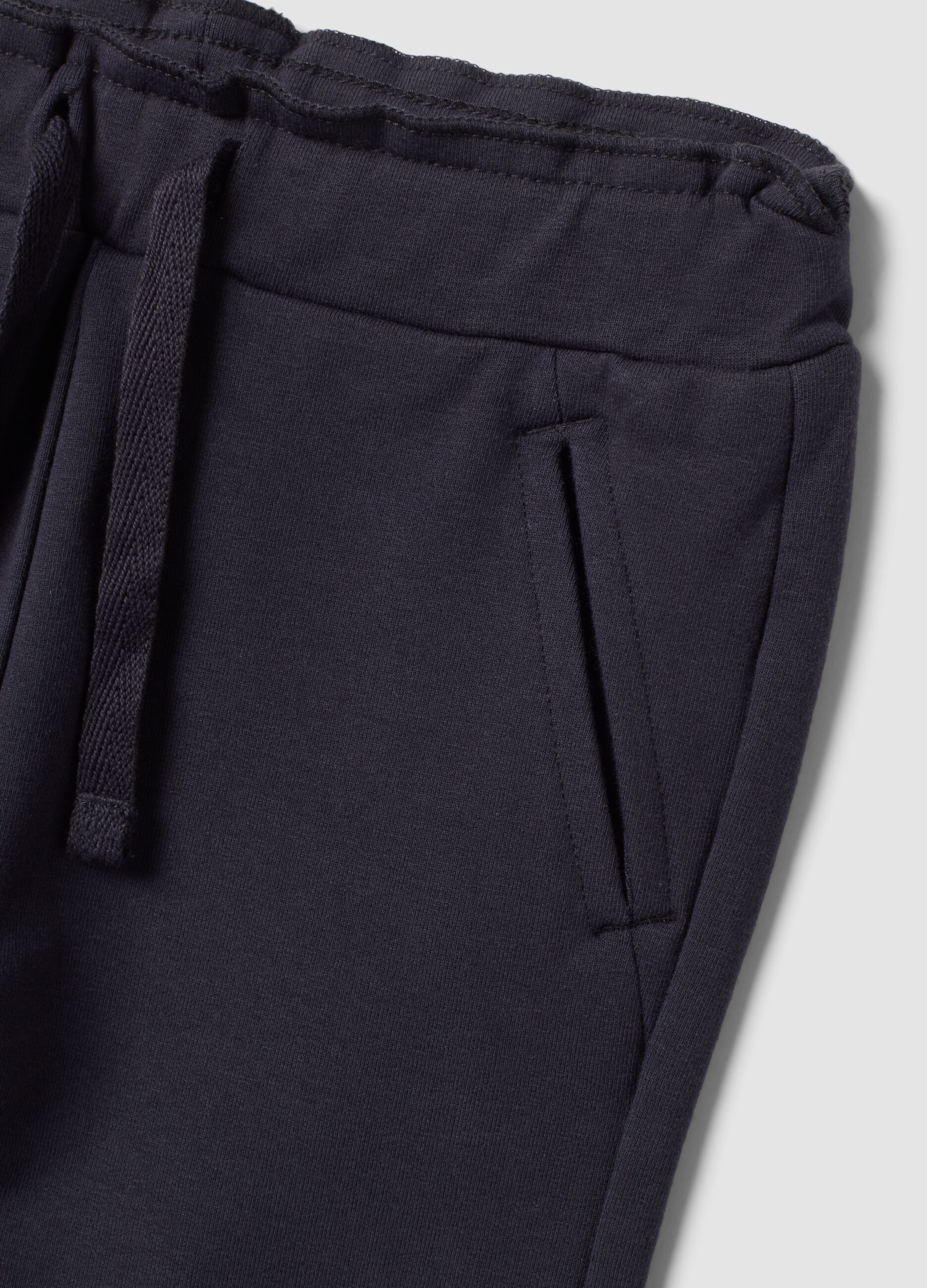 Grey stretch cotton joggers with turn-up cuffs for baby girl