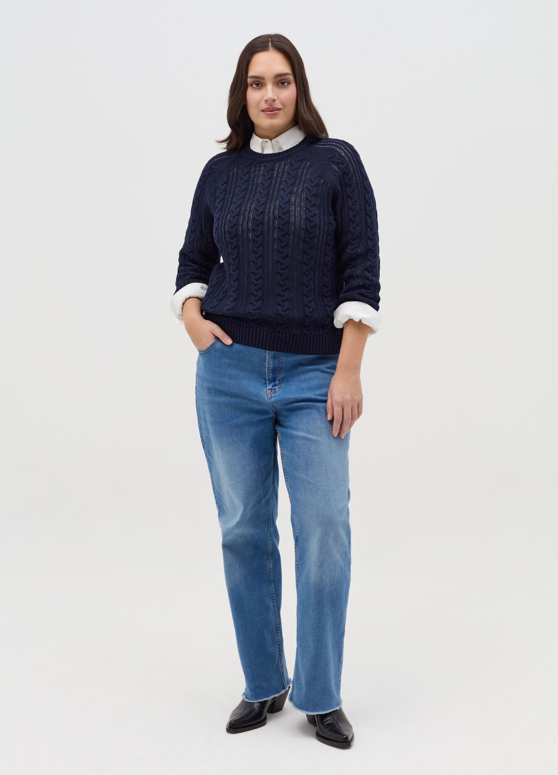 Curvy crochet pullover with cable-knit design