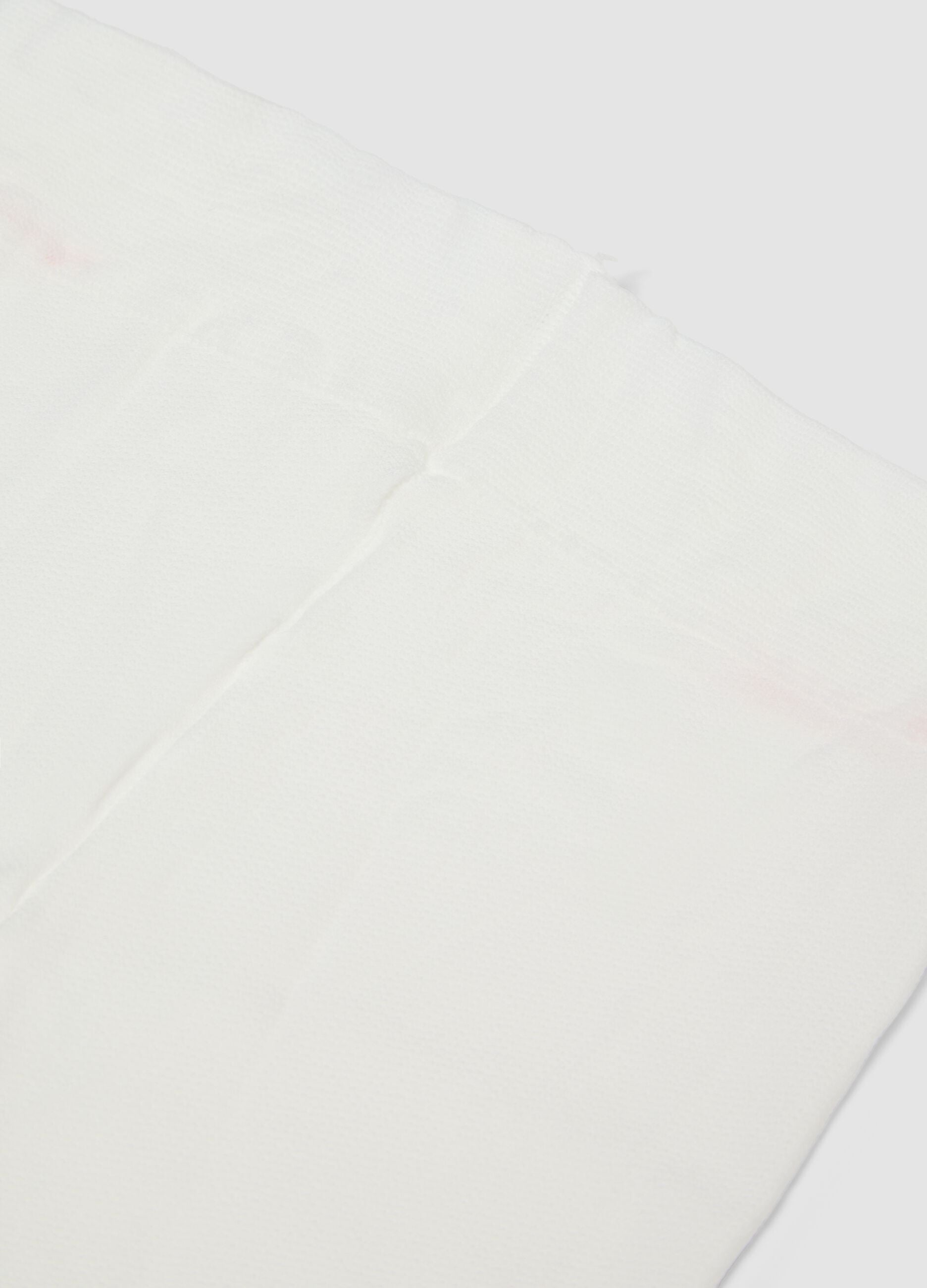 Collant bianco in tessuto elasticizzato con motivo lavorato
