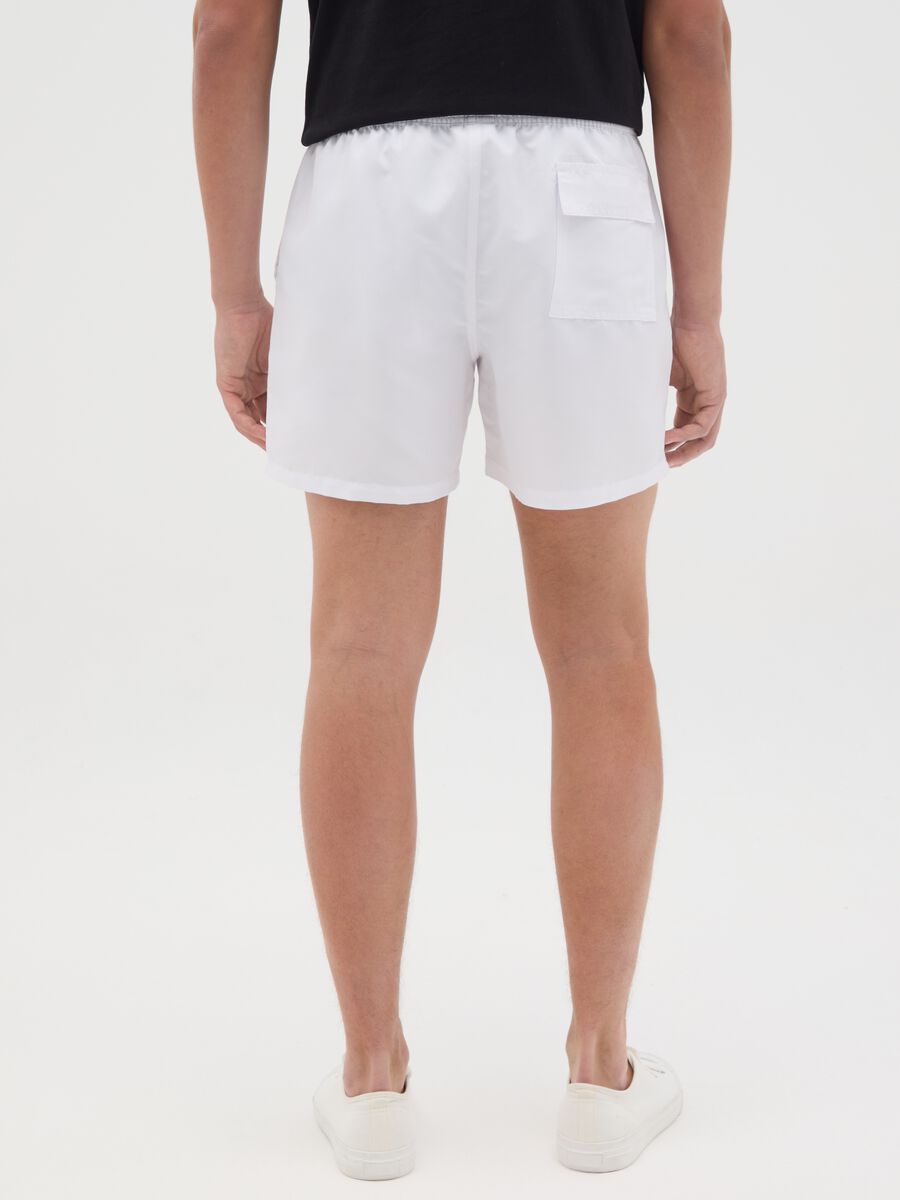 White swimming trunks with logo print_3