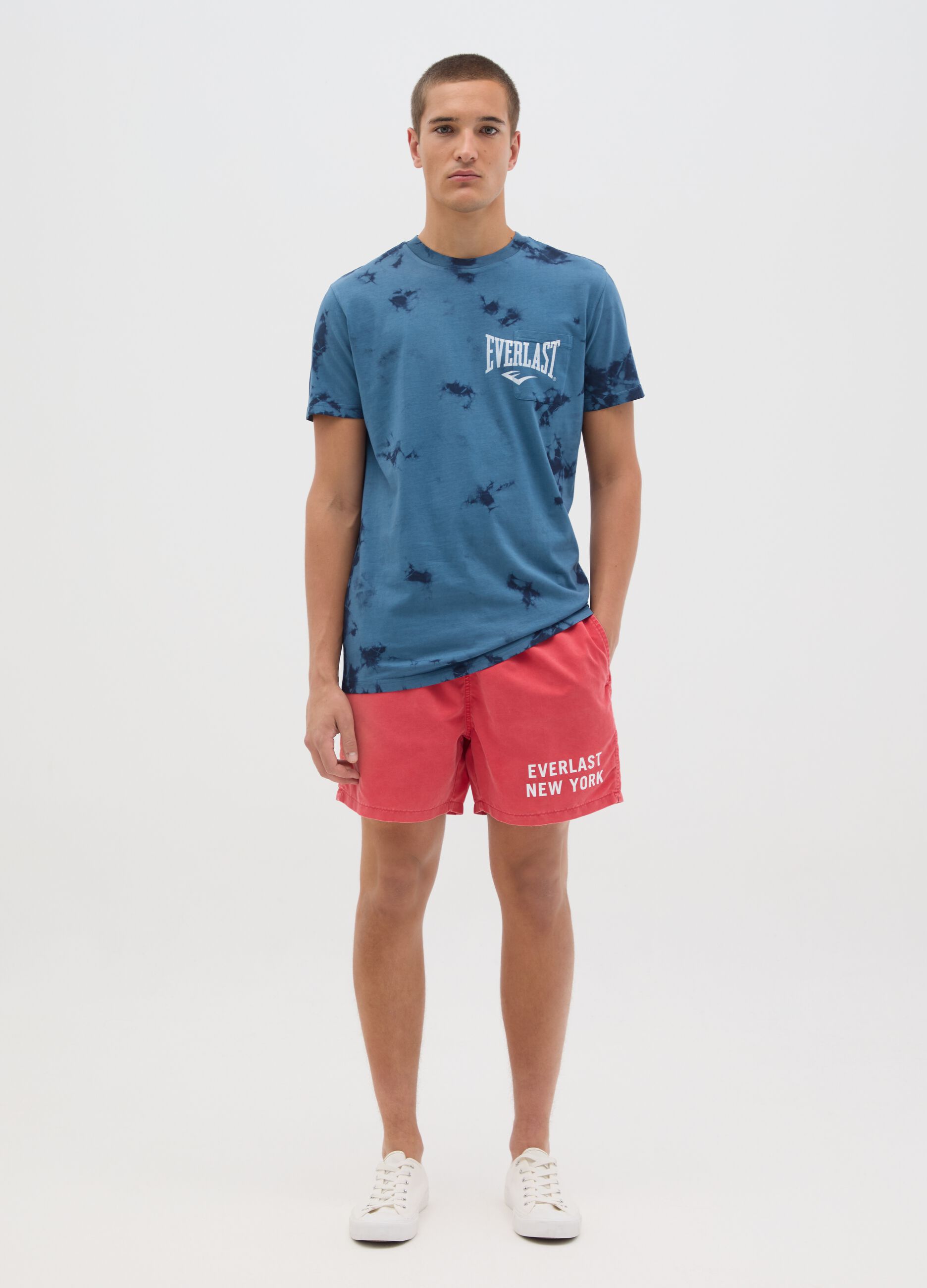 Red swimming trunks with logo print