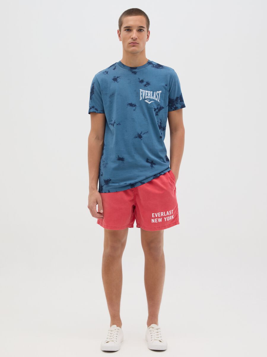 Red swimming trunks with logo print_0