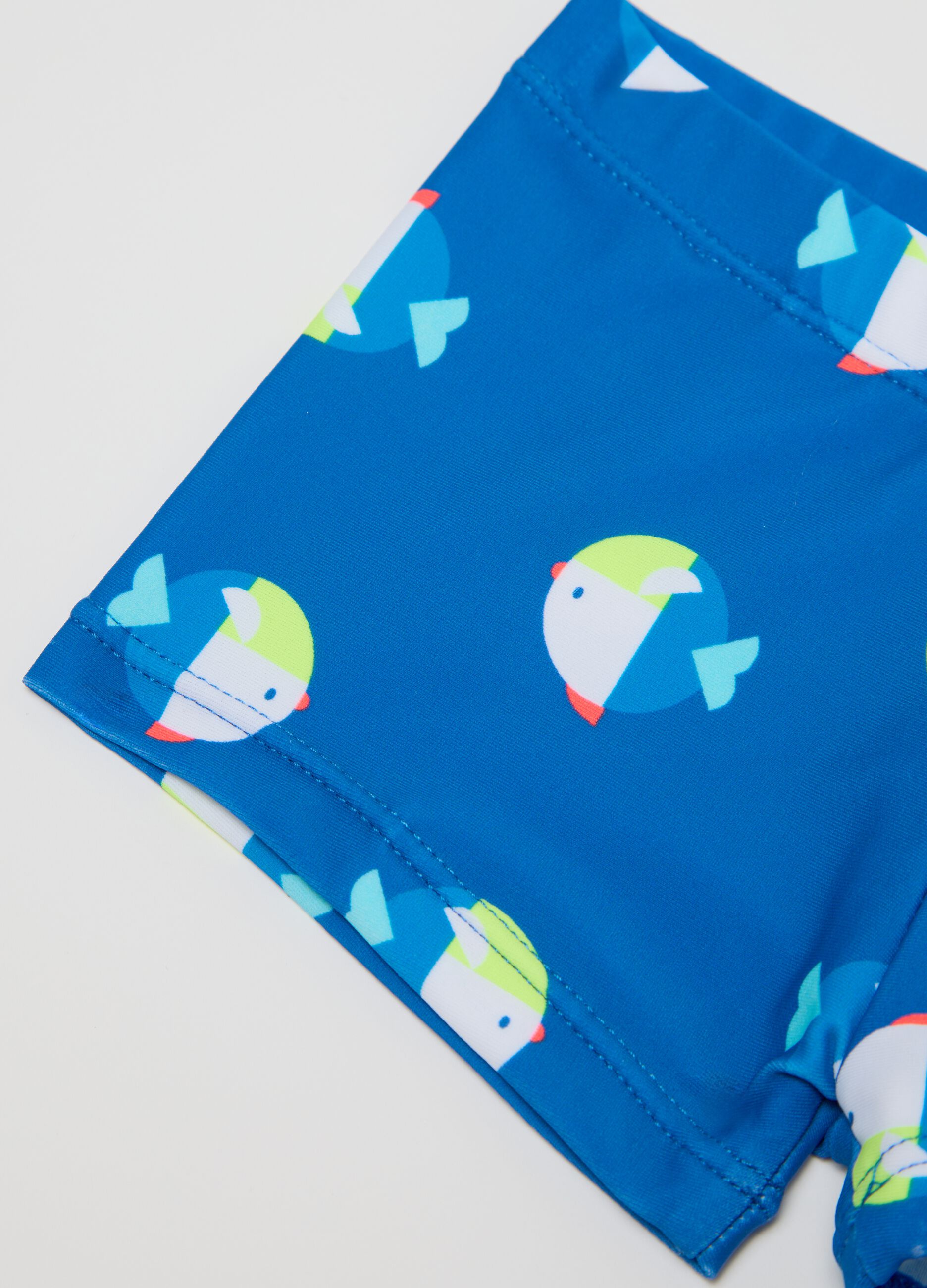 Boys’ costume in blue stretch fabric with fish pattern