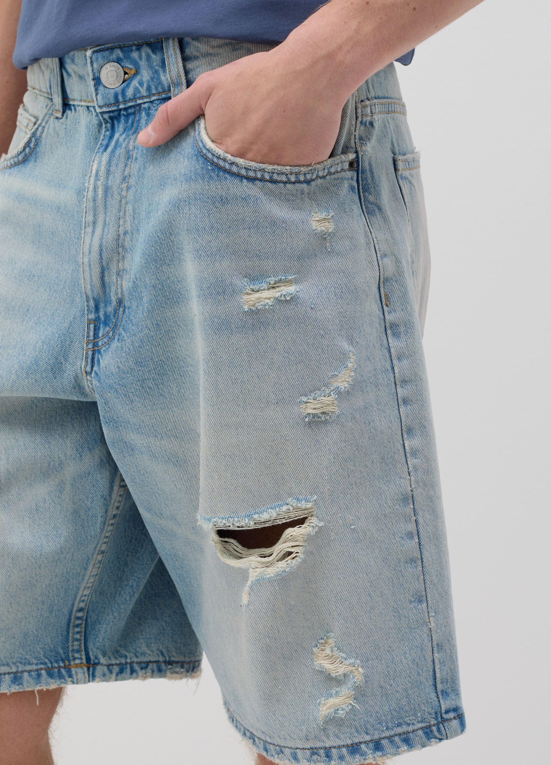 Blue denim shorts with ripped details