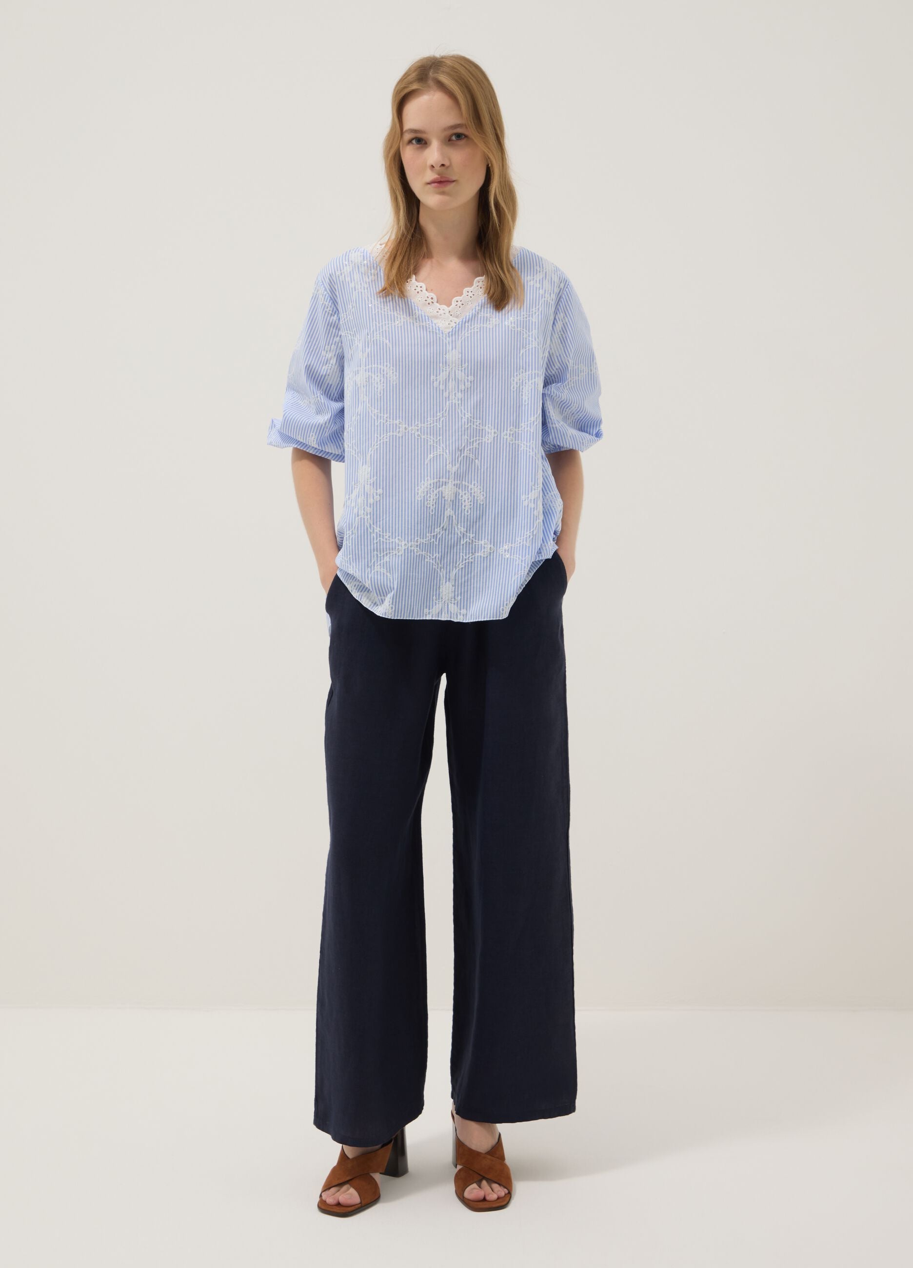 Blue cotton-blend top with embroidery and V-neck