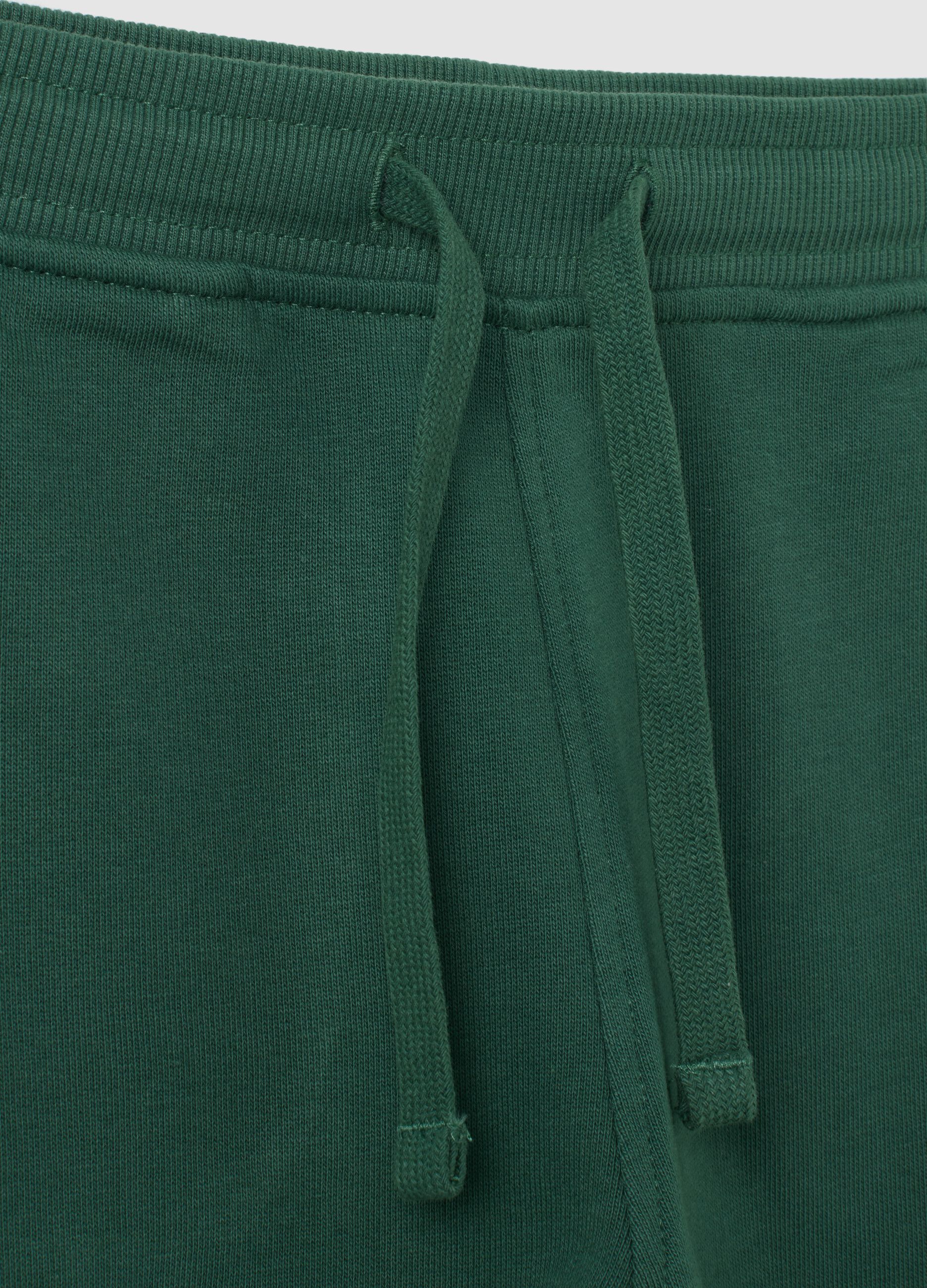 Children's green regular fit jogger trousers in pure cotton