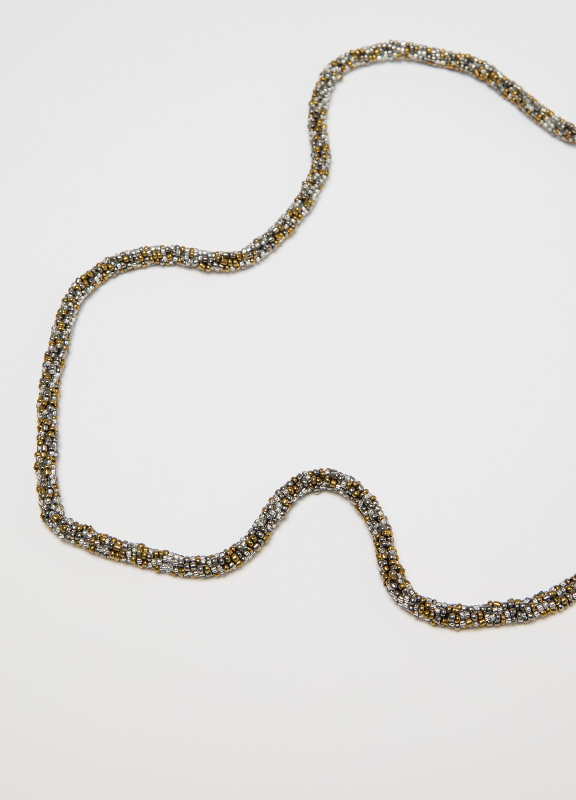 Collana lunga grigio e oro con perline e nappine