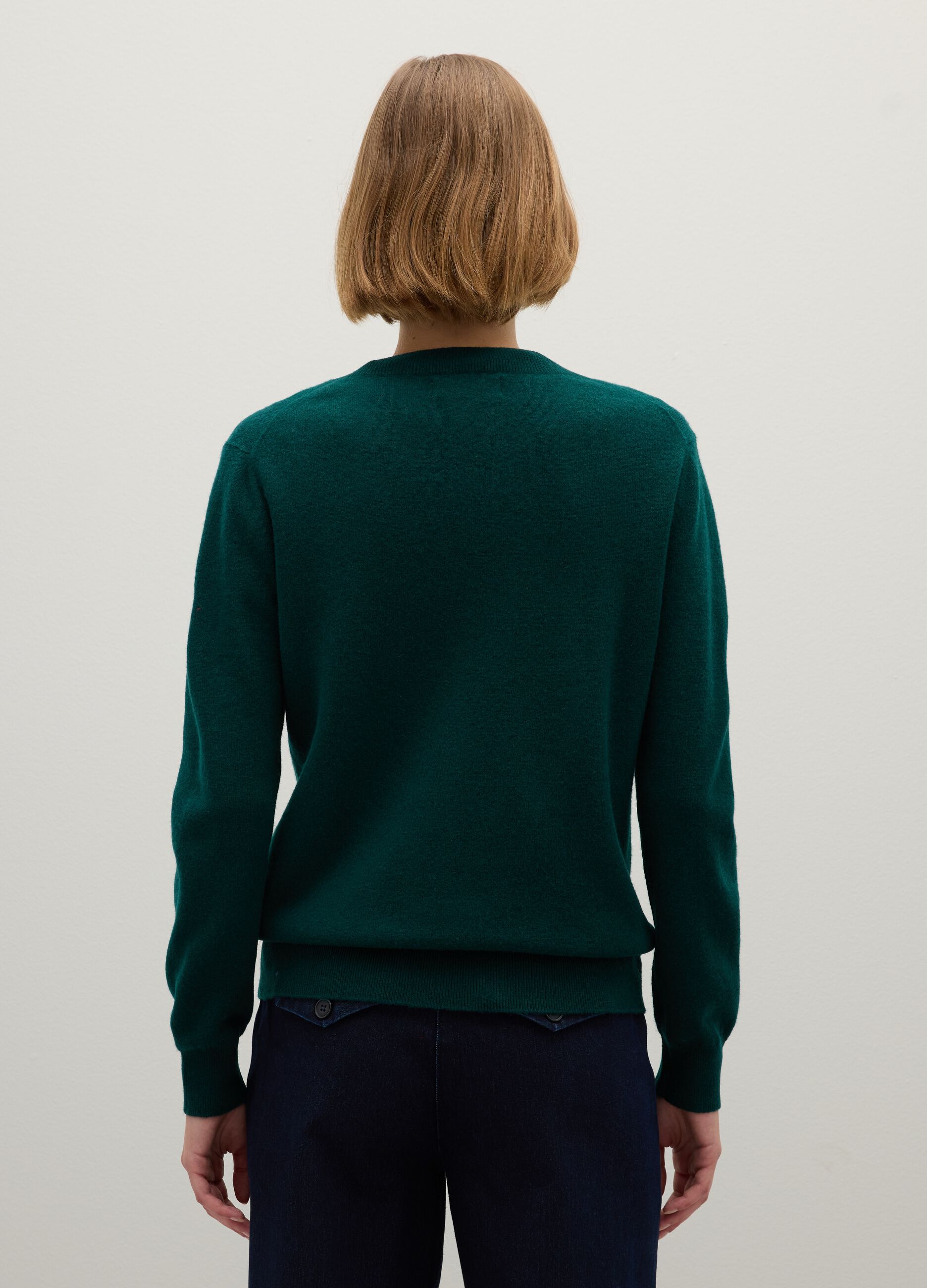Green V-neck wool sweater