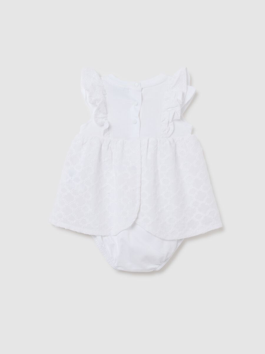 Baby girl's dress in pure white cotton with ruffles_1