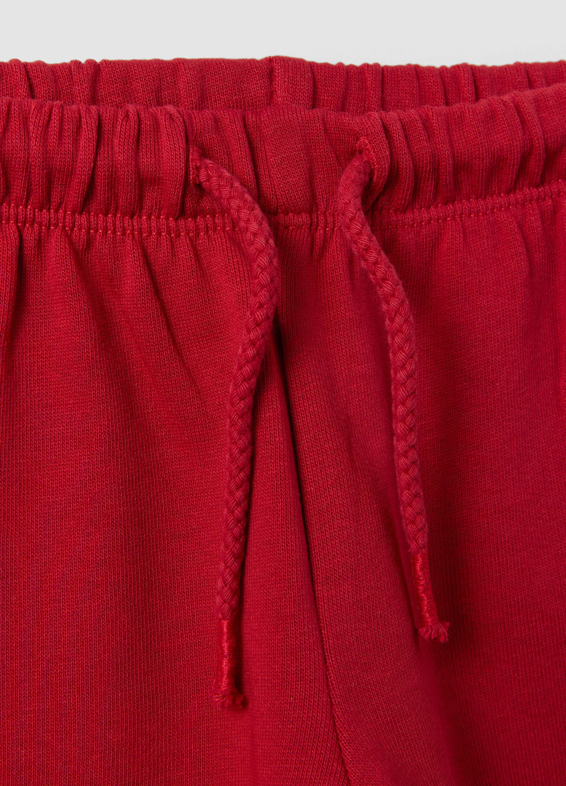 Red pure cotton trousers with elasticated waist and print for baby girls