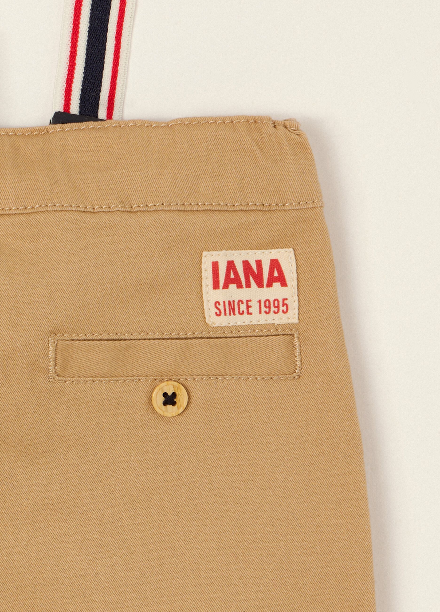 Beige baby trousers in stretch cotton with braces
