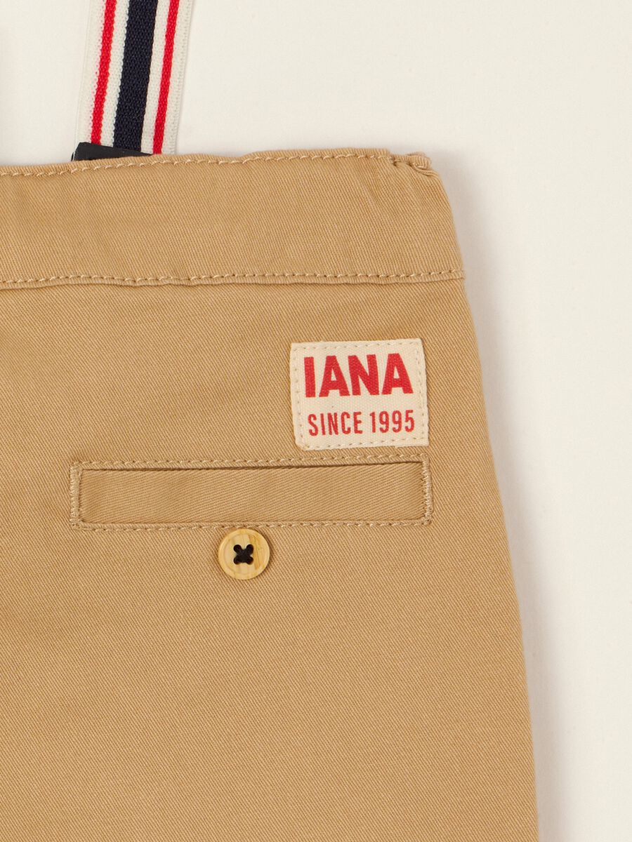 Beige baby trousers in stretch cotton with braces_1