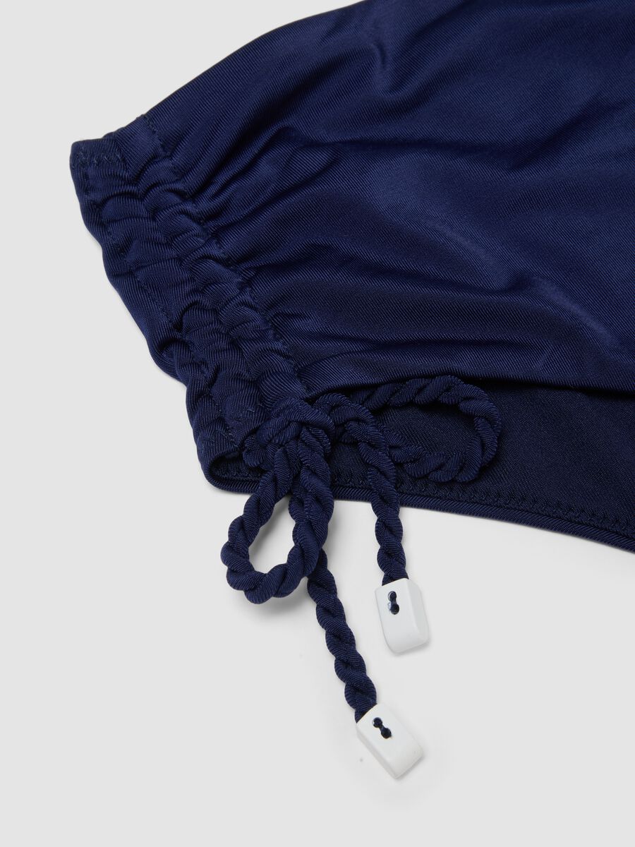 Slip bikini blu in tessuto elasticizzato con laccetti laterali_5