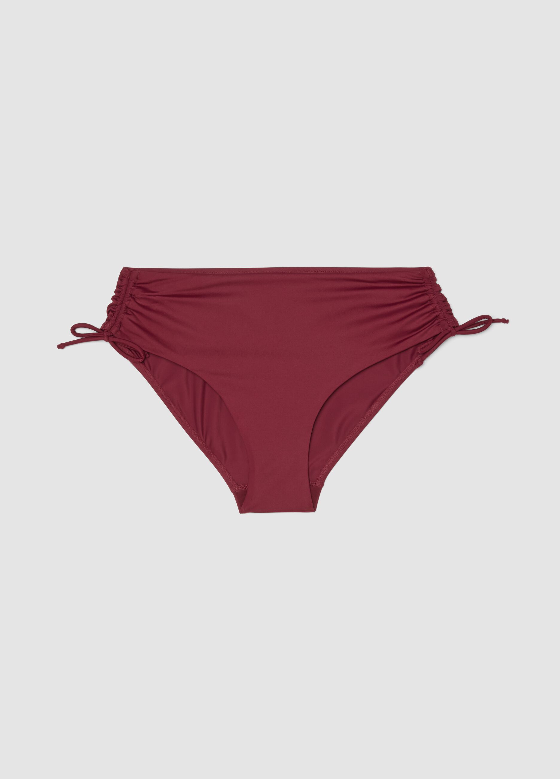 Red stretch bikini bottoms with ruched side detailing