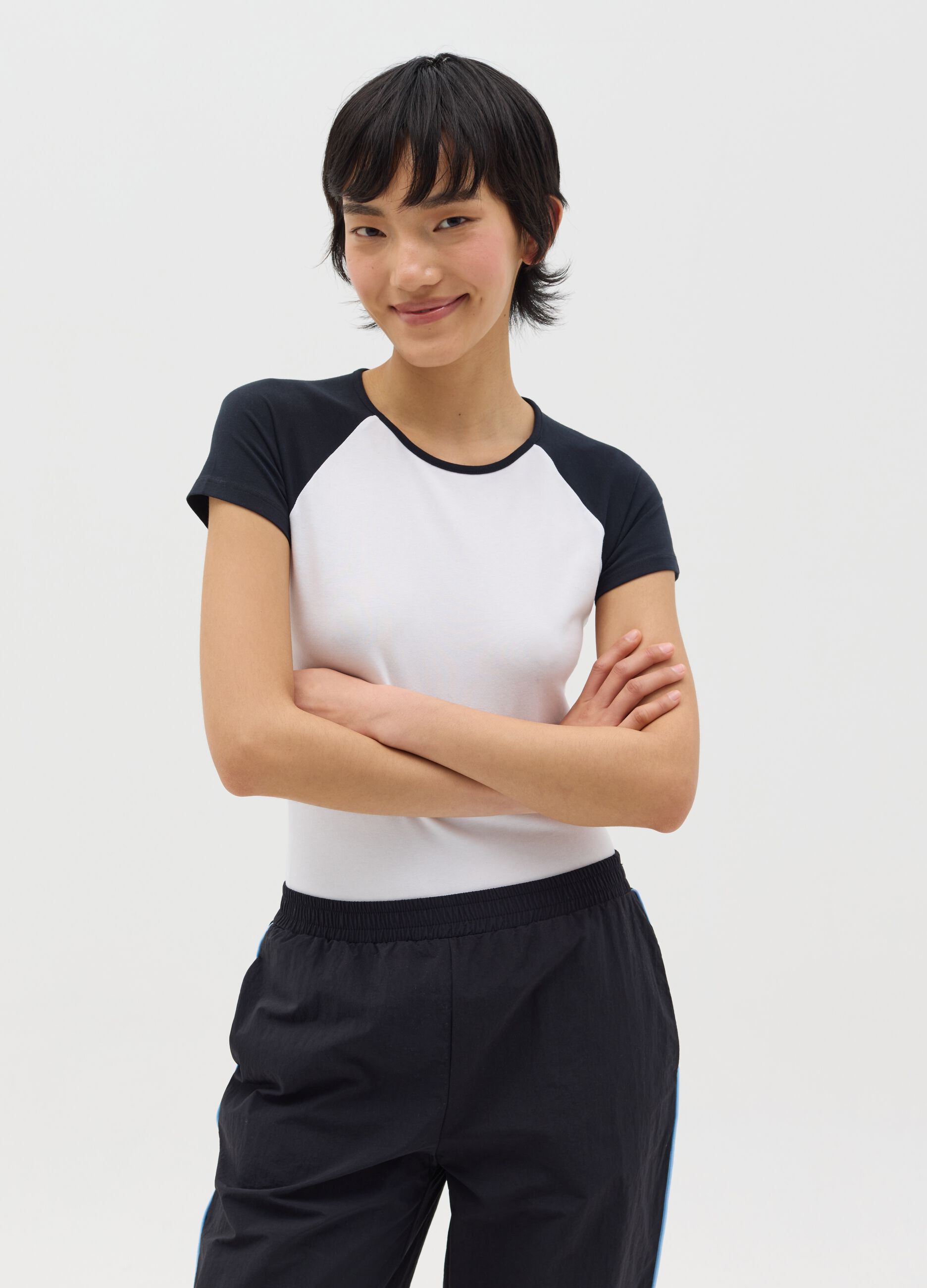 White bodysuit with short red sleeves