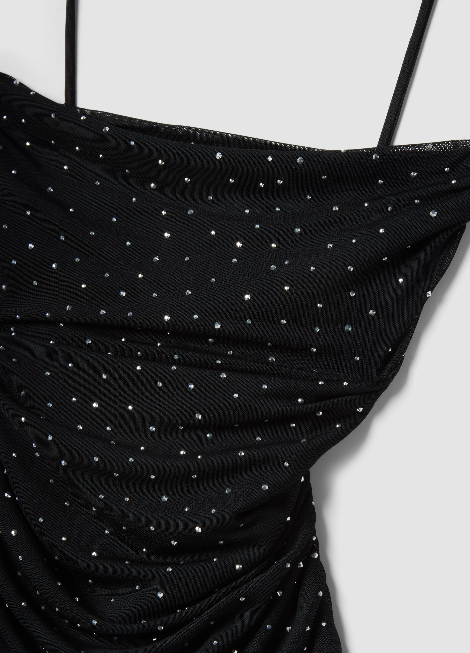 Black mini dress in stretch fabric with rhinestones