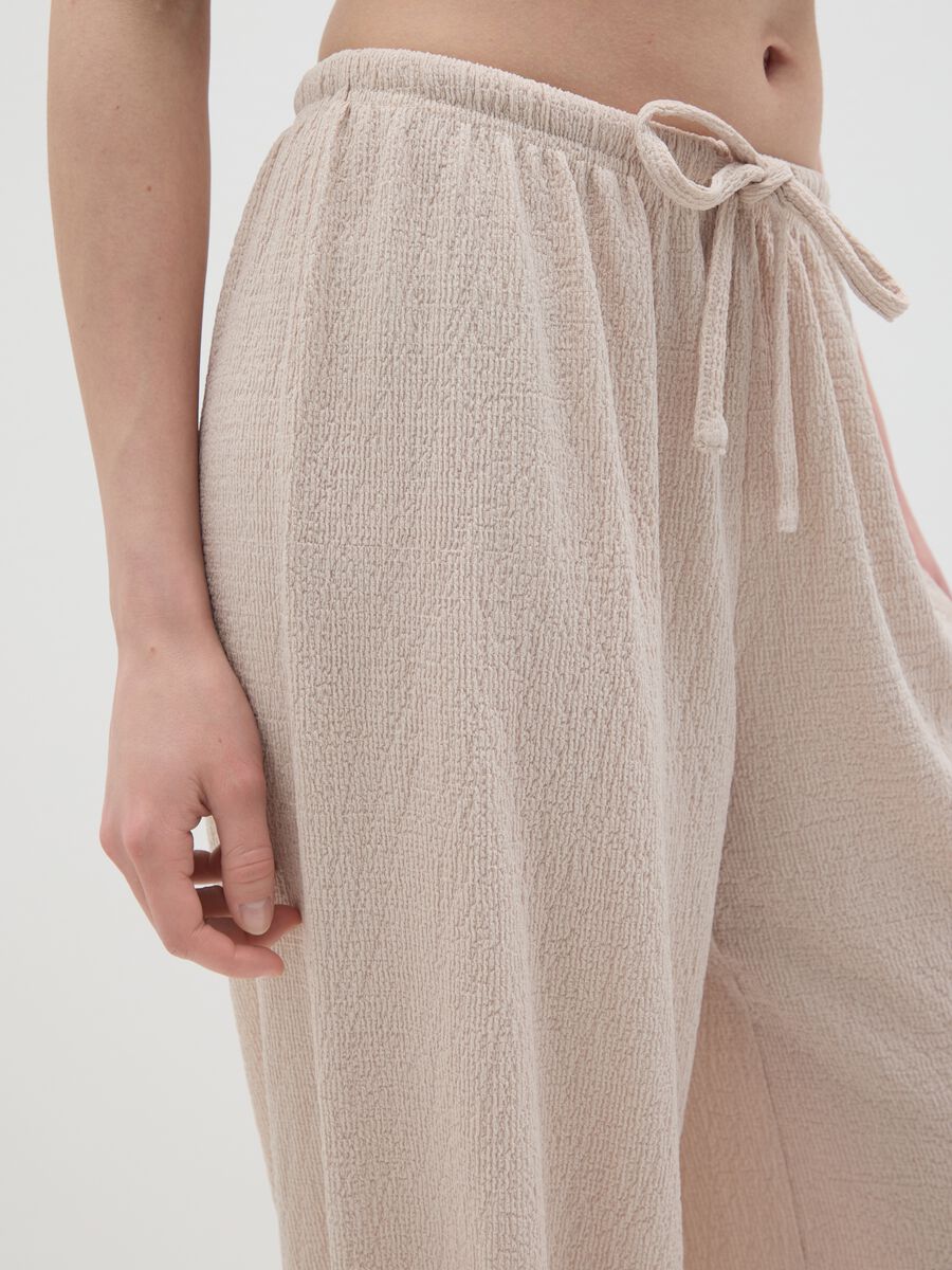 Women's beige regular-fit palazzo pants in stretch fabric._2