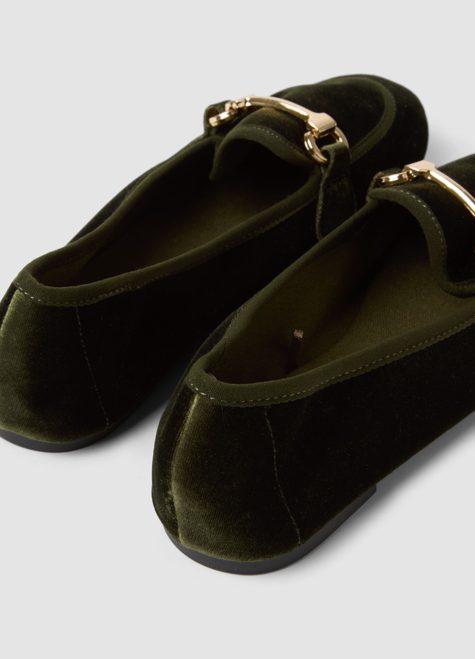 Green loafers with gold-tone bit