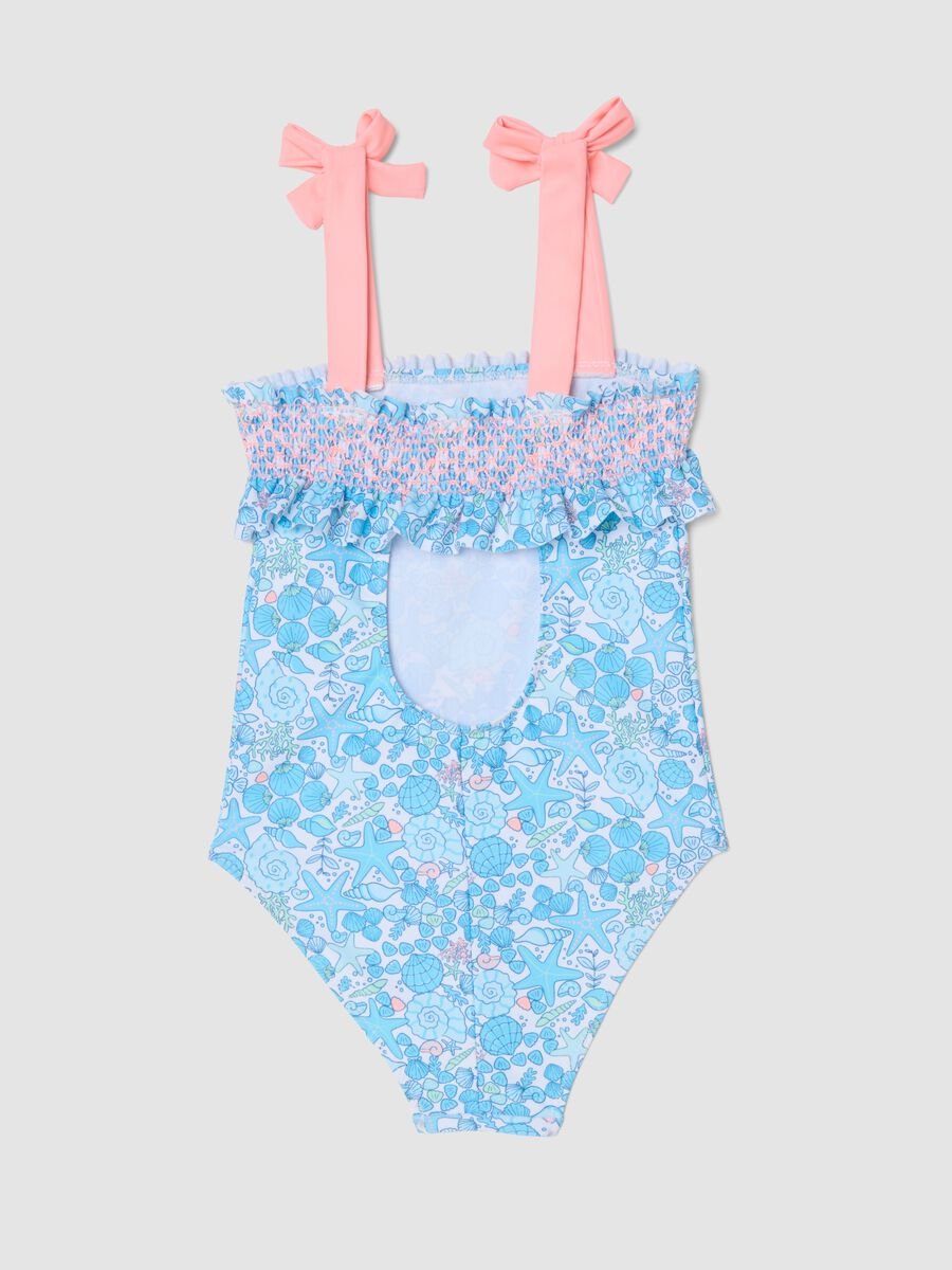 Costume intero azzurro in tessuto elasticizzato con stampa marina per bambina_1