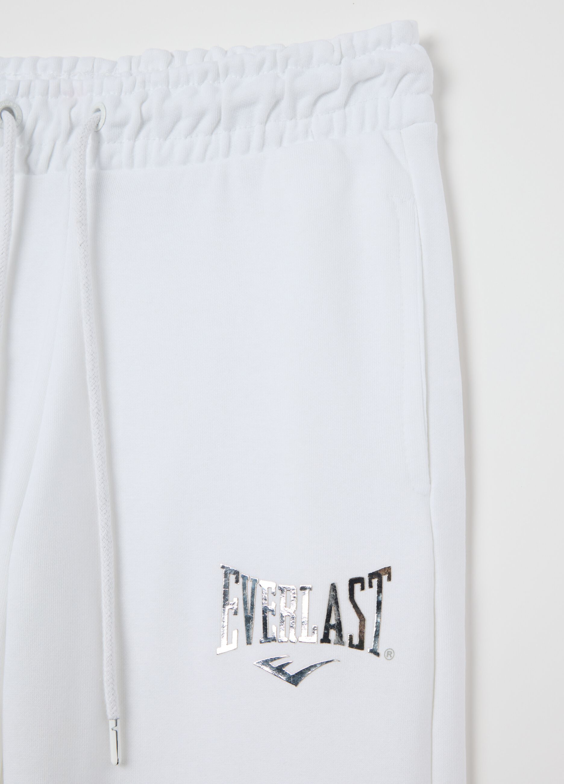 White flare joggers with drawstring and logo print