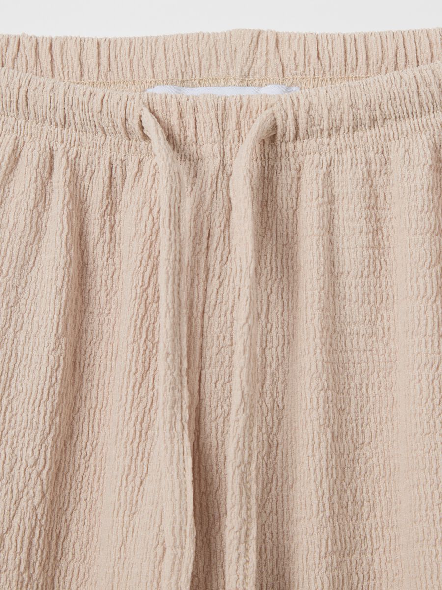 Women's beige regular-fit palazzo pants in stretch fabric._5