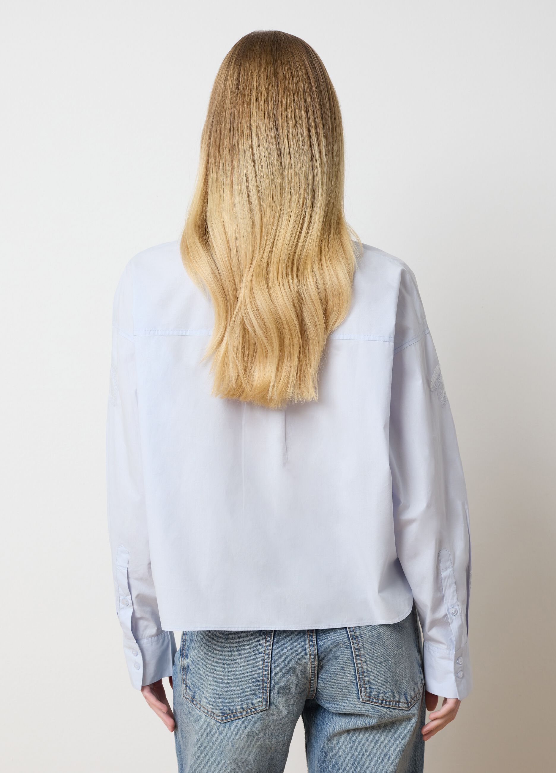 Light blue cropped shirt with floral embroidery
