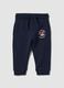 Pantaloni jogger blu in puro cotone con stampa cagnolino per bimbo_0