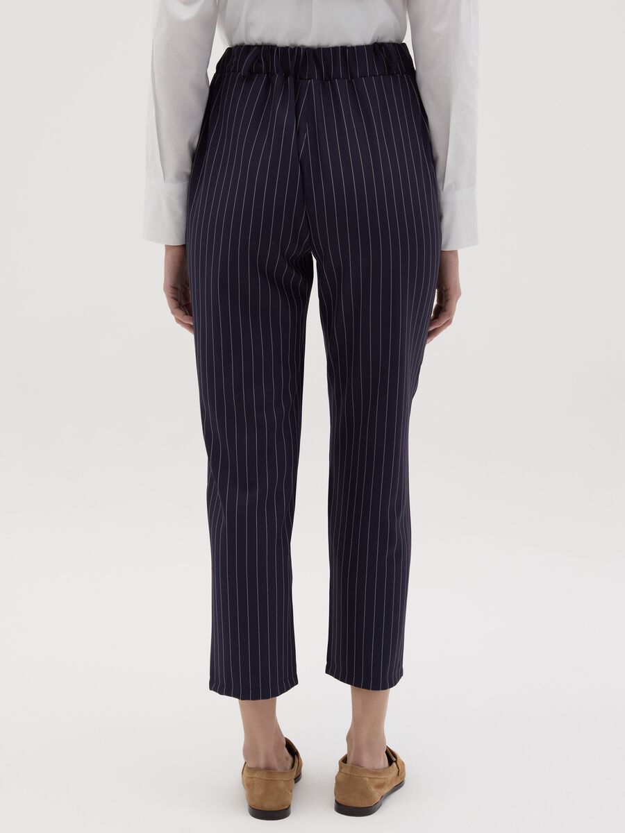 Cropped pinstriped trousers with frills_3
