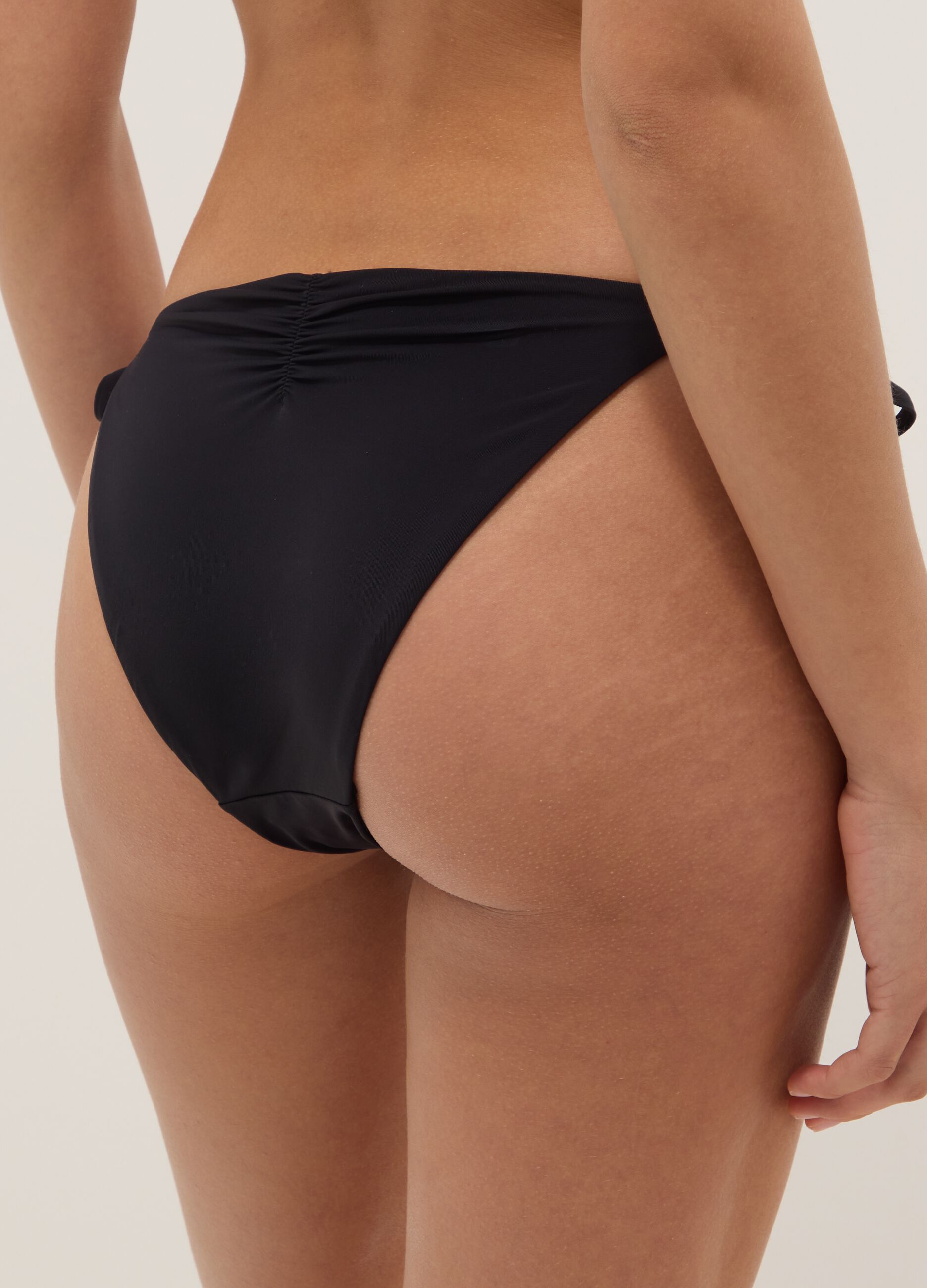 Black stretch bikini bottoms with sparkling details