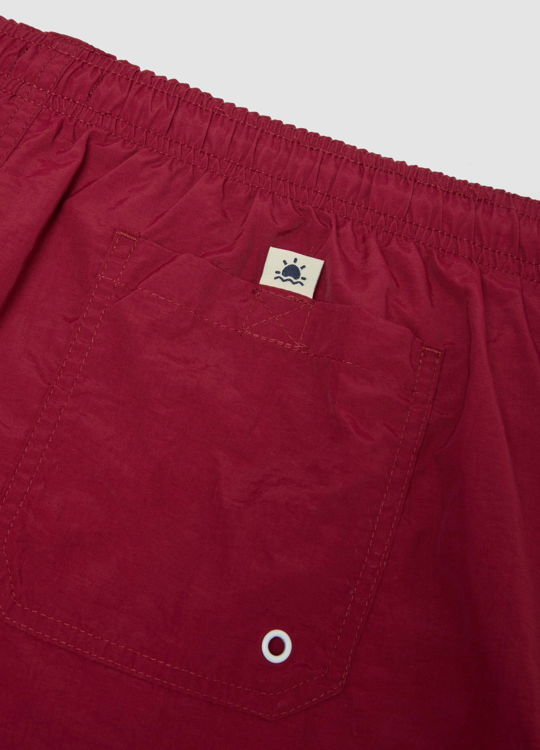 Red regular-fit swim shorts with drawstring