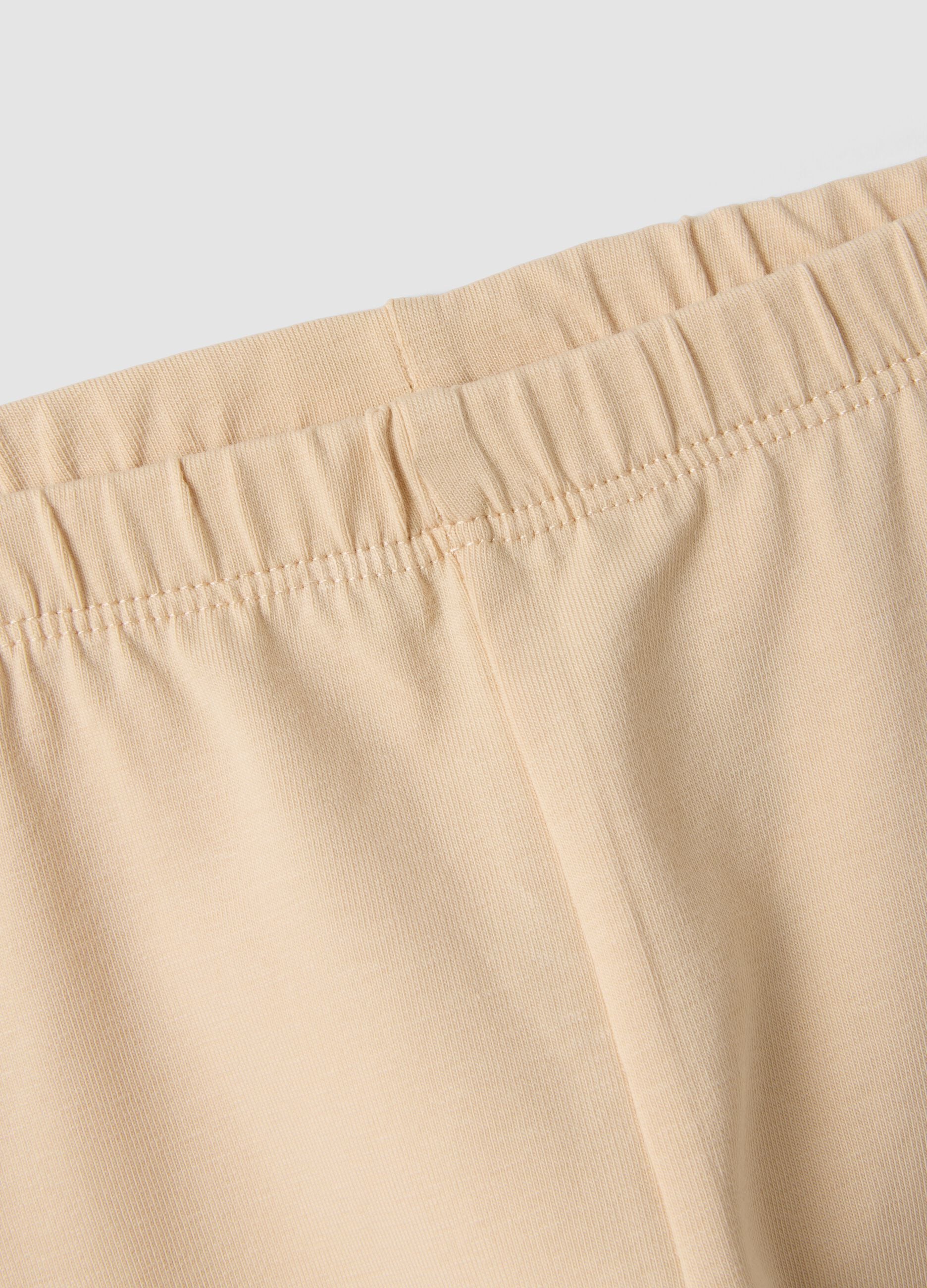 Beige stretch organic cotton leggings with bows for baby girl