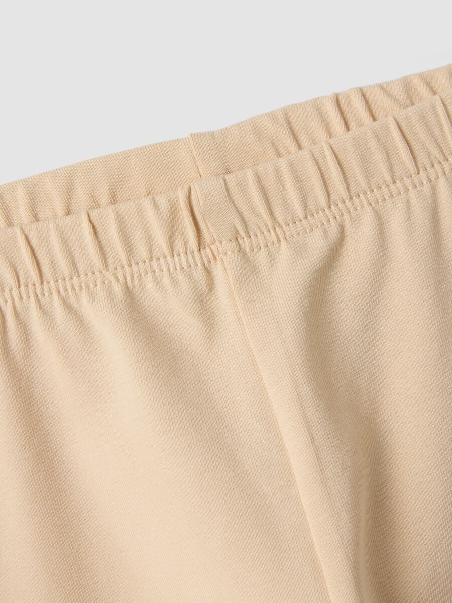 Leggings beige in cotone organico elasticizzato con fiocchi per bimba_3