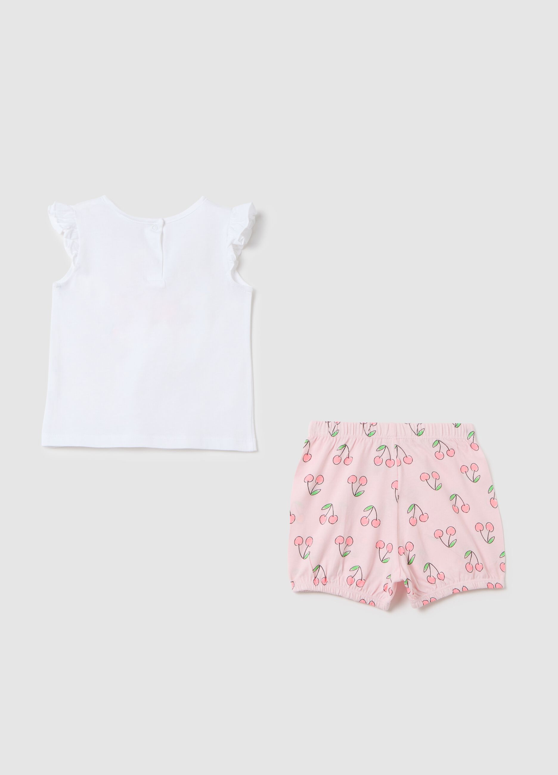 Short pyjama set with white top and cherry-patterned pink shorts