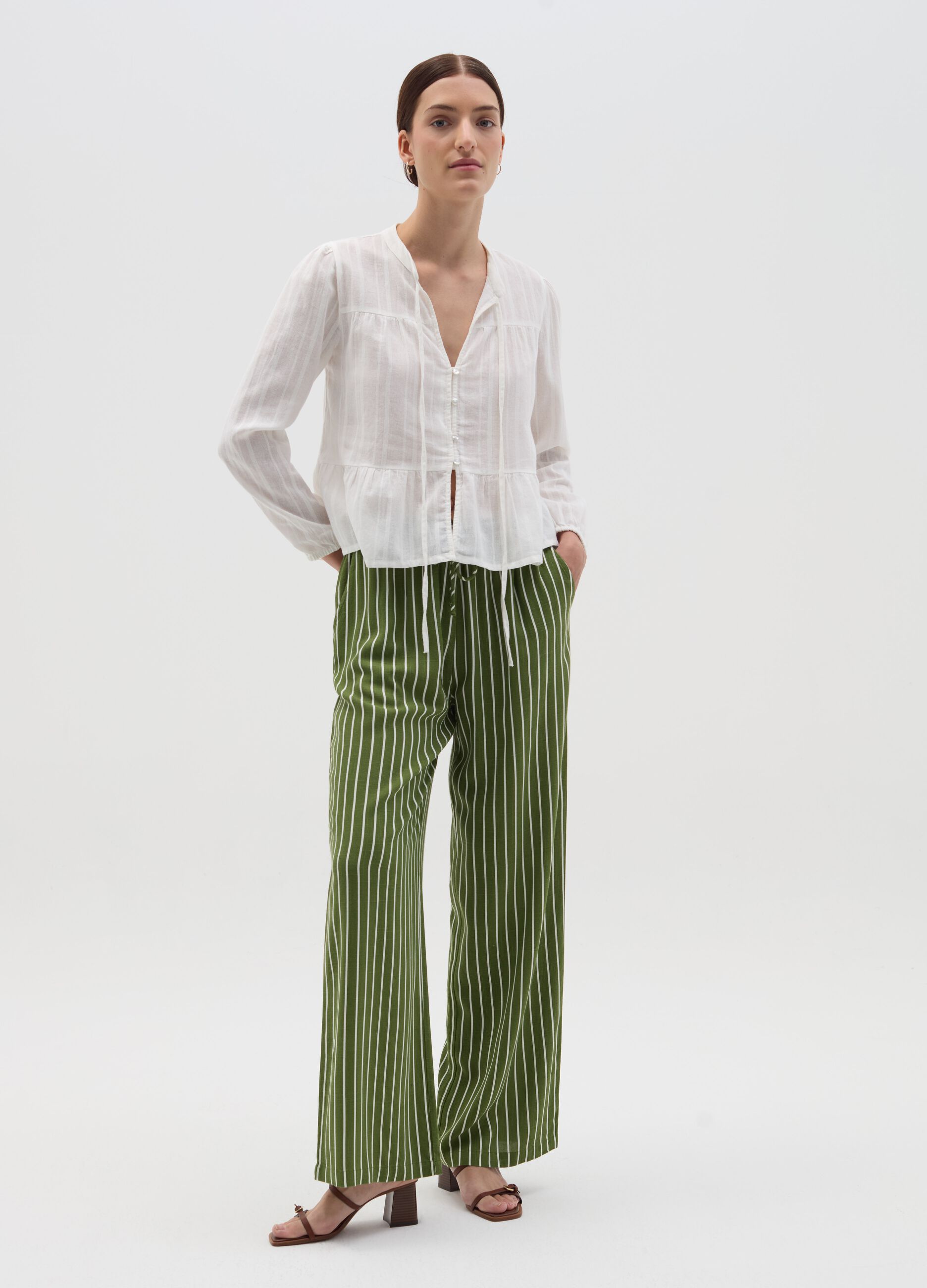 Striped green palazzo trousers in viscose and linen