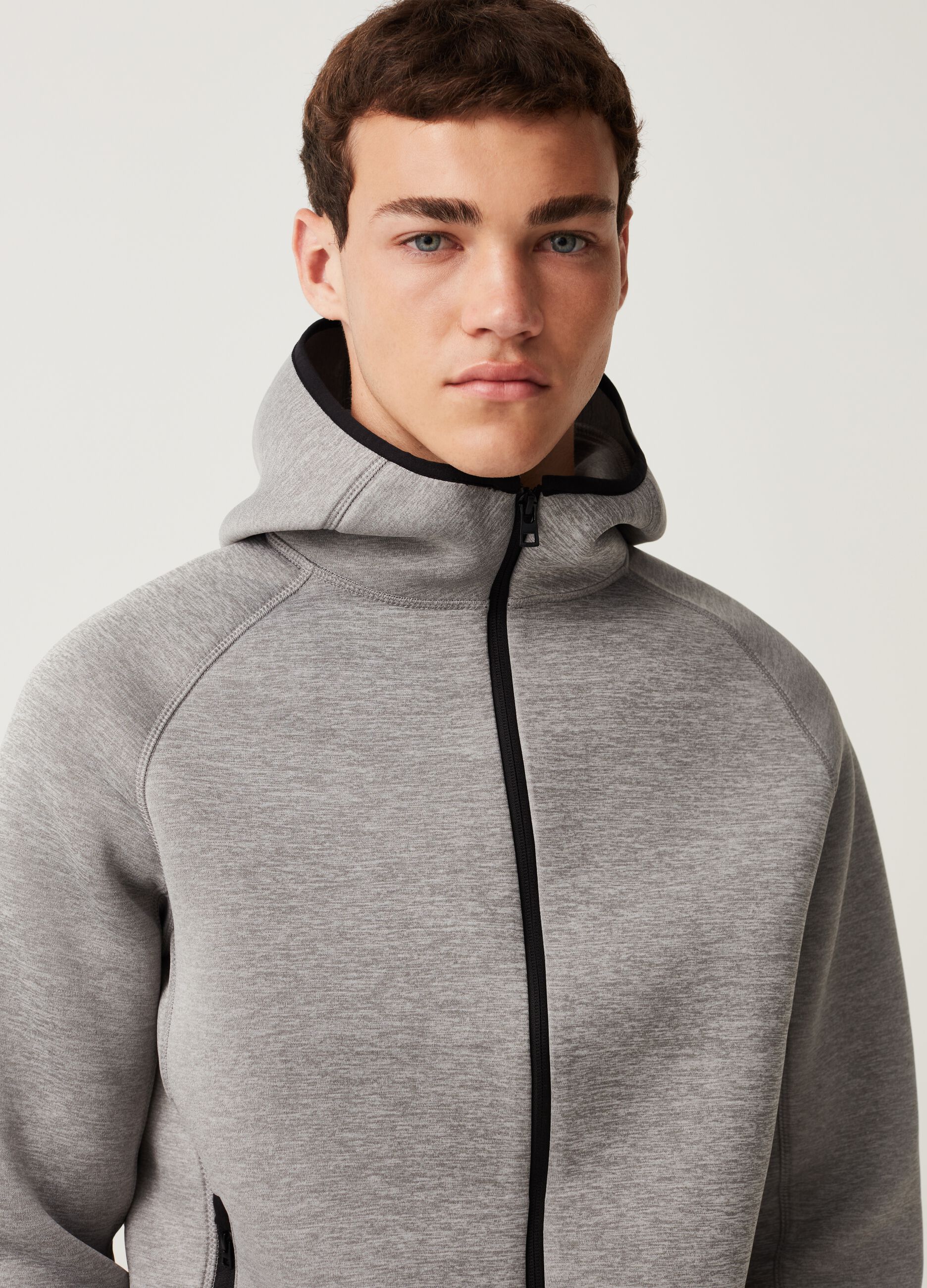 Full-zip sweatshirt with hood and raglan sleeves.