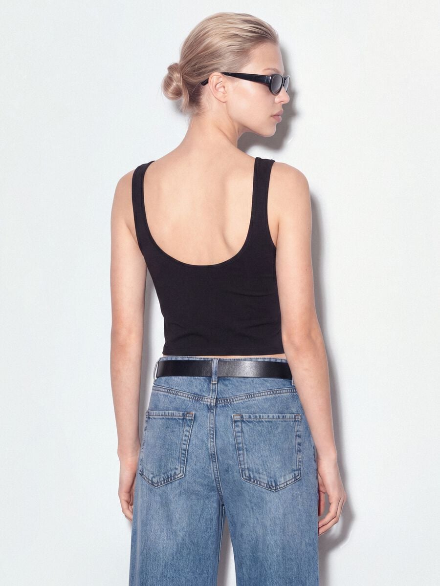 Black stretch cotton top with asymmetric hem and metal eyelets_2